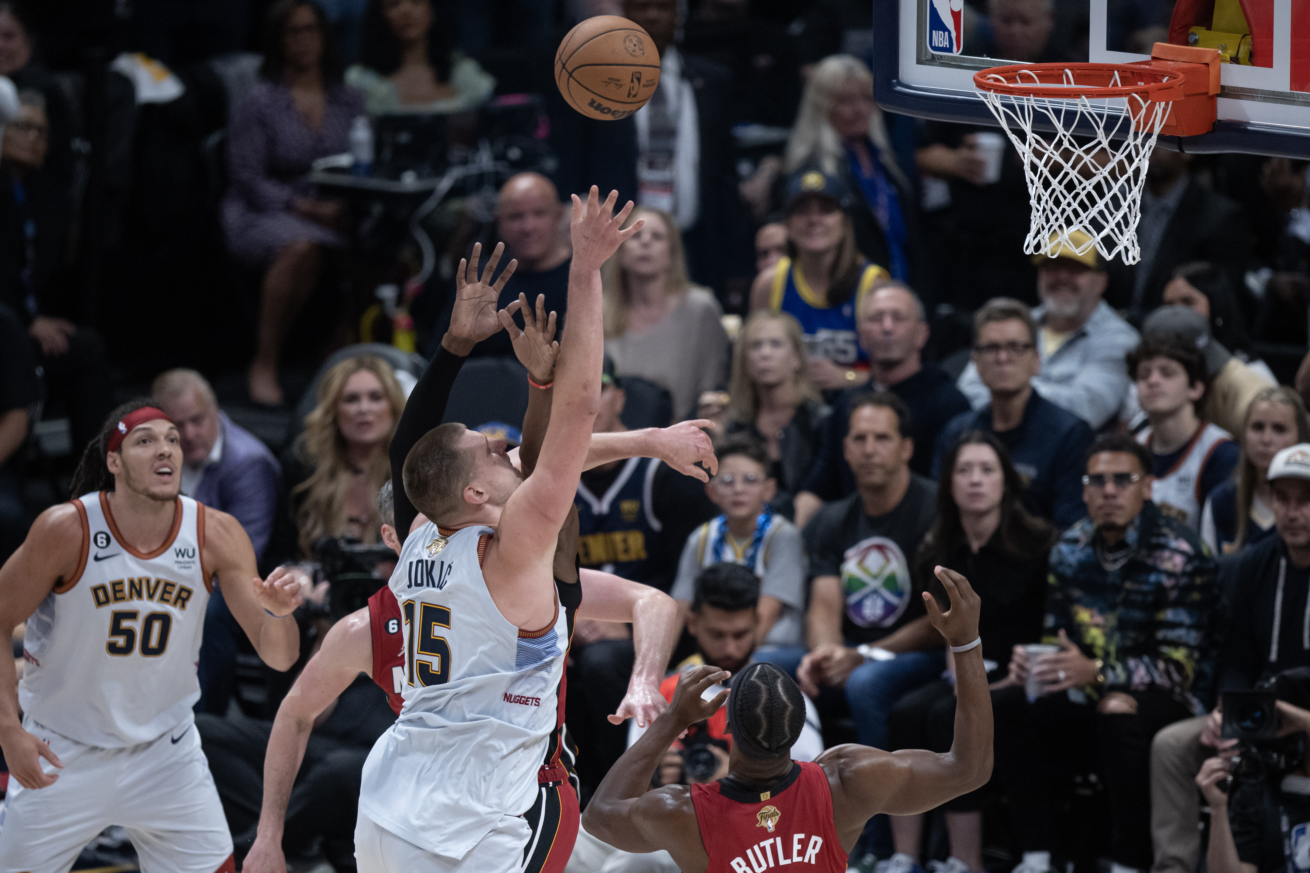 Denver Nuggets center Nikola Jokic (15) makes a shot over Miami Heat forward Jimmy Butler (22) in a 94-89 win over the Miami Heat in Game 5 of the NBA Finals on Monday, June 12, 2023, at Ball Arena in Denver. (Timothy Hurst/Denver Gazette) (TimHursttim.hurst@gazette.comhttps://secure.gravatar.com/avatar/aca82bd62b4ee425c598527cd6faa1b1?d=mm&r=g)