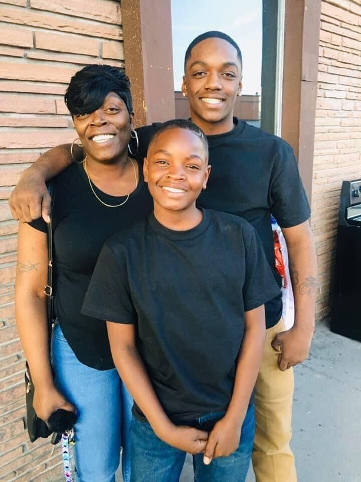 Jor'Dell Richardson (center) with mom, Laurie Littlejohn, and his older brother. The 14-year-old was shot and allegedly killed by Aurora Police June 1 after allegedly robbing an Aurora vape store with several teens. (Courtesy of Rathod Mohamedbhai LLC)