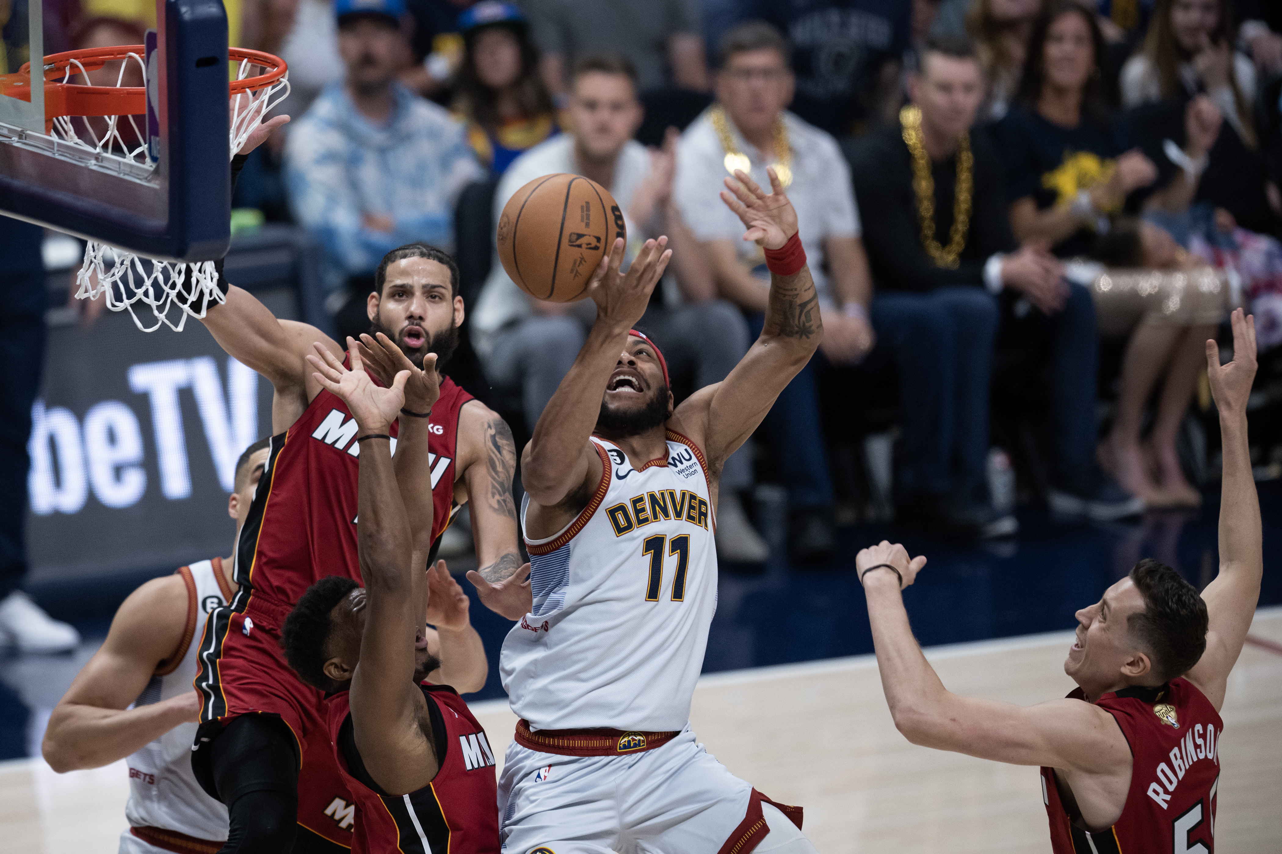 Denver Nuggets forward Bruce Brown (11) has the ball batted away by Miami Heat forward Nikola Jovic (5) during the first quarter of Game 5 of the NBA Finals on Monday, June 12, 2023, at Ball Arena in Denver. (Timothy Hurst/Denver Gazette) (TimHursttim.hurst@gazette.comhttps://secure.gravatar.com/avatar/aca82bd62b4ee425c598527cd6faa1b1?d=mm&r=g)