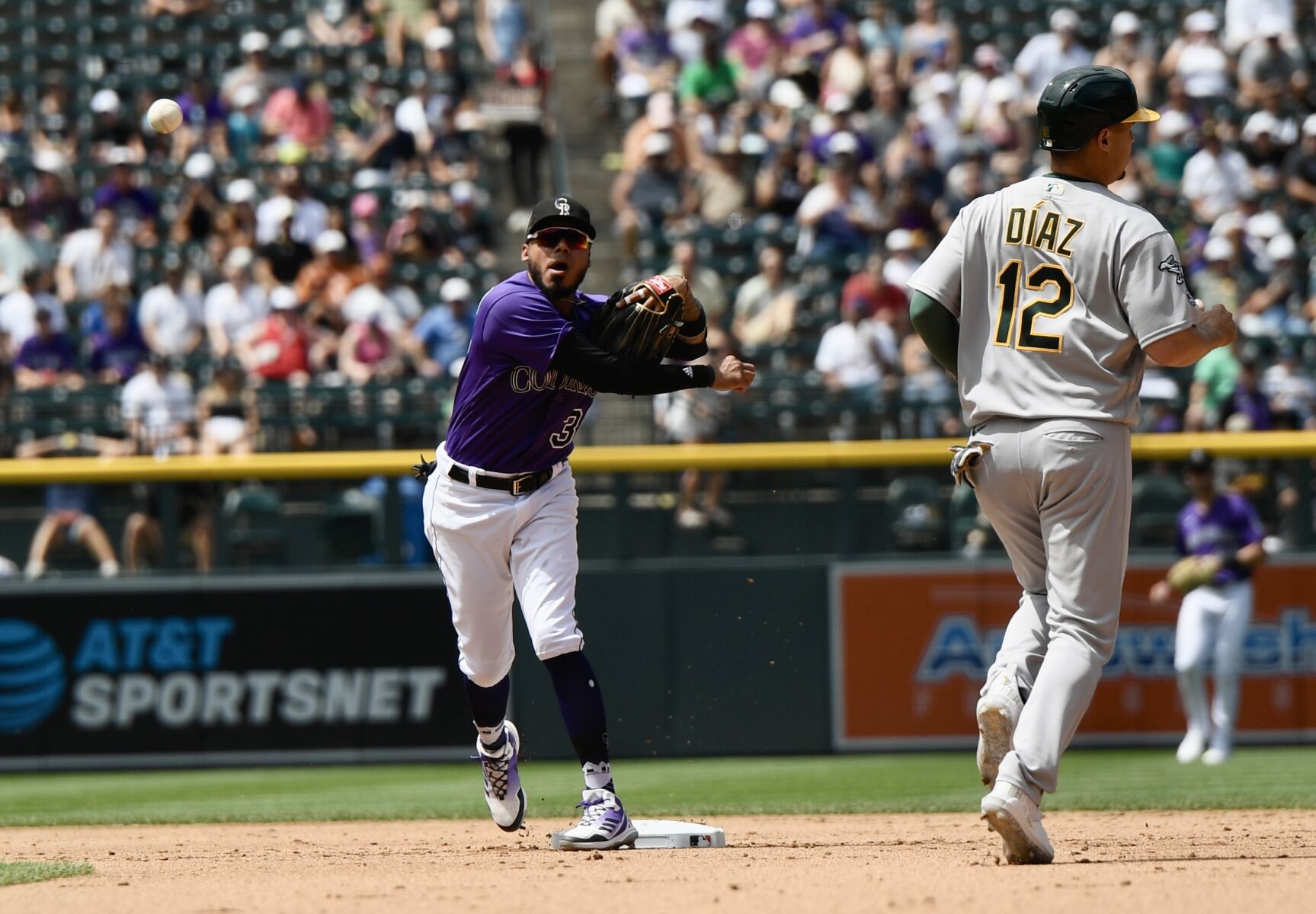 Rockies infielder Harold Castro throws to first base against the Oakland Athletics on Saturday, July 30, 2023. (CarsonFieldcarson.field@gazette.comhttps://secure.gravatar.com/avatar/c524ef3d384945349bed78d70eb2d2cd?d=mm&r=g)