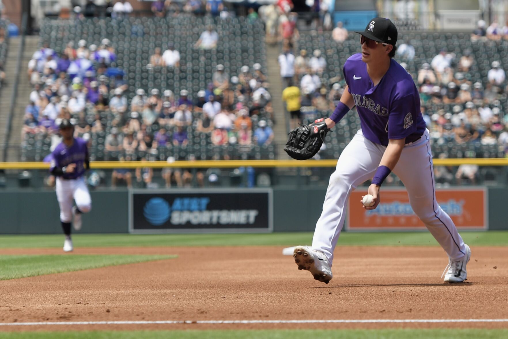 Rockies infielder Michael Toglia tosses to first base against the Oakland Athletics on Saturday, July 30, 2023. (CarsonFieldcarson.field@gazette.comhttps://secure.gravatar.com/avatar/c524ef3d384945349bed78d70eb2d2cd?d=mm&r=g)