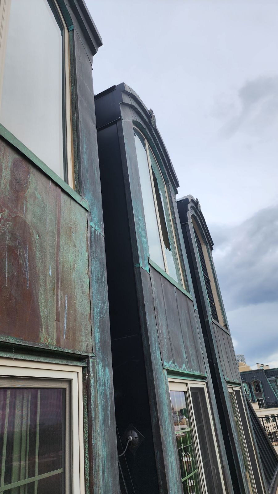 One of five windows shattered by stray bullets at The Beauvallon condominiums off 9th and Lincoln streets in downtown Denver. (Courtesy of Matt Garrett)