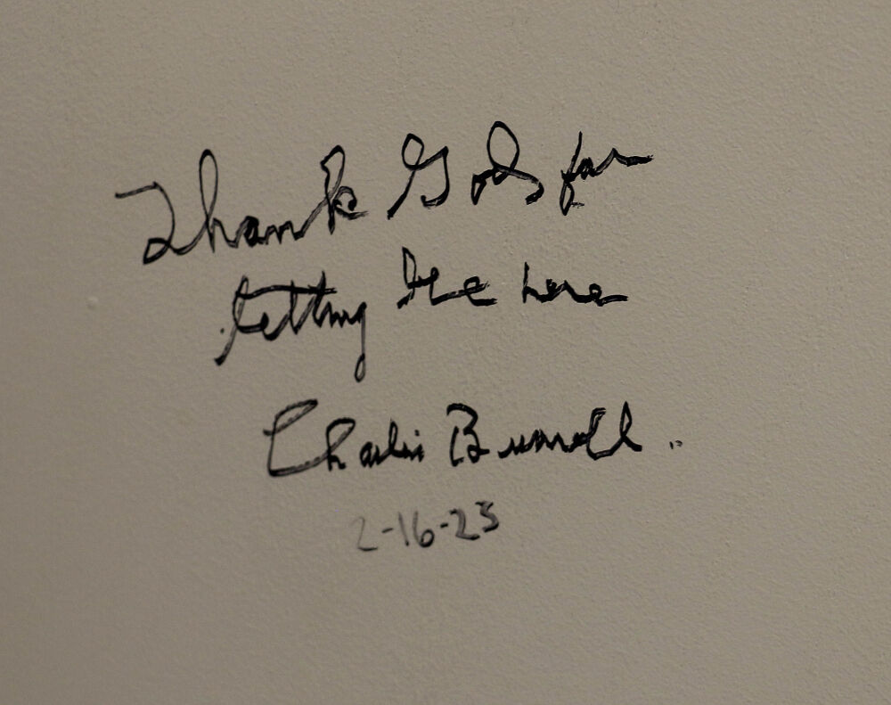 A wall message signed by 102-year-old legend Charles Burrell. (John Moore, The Denver Gazette)