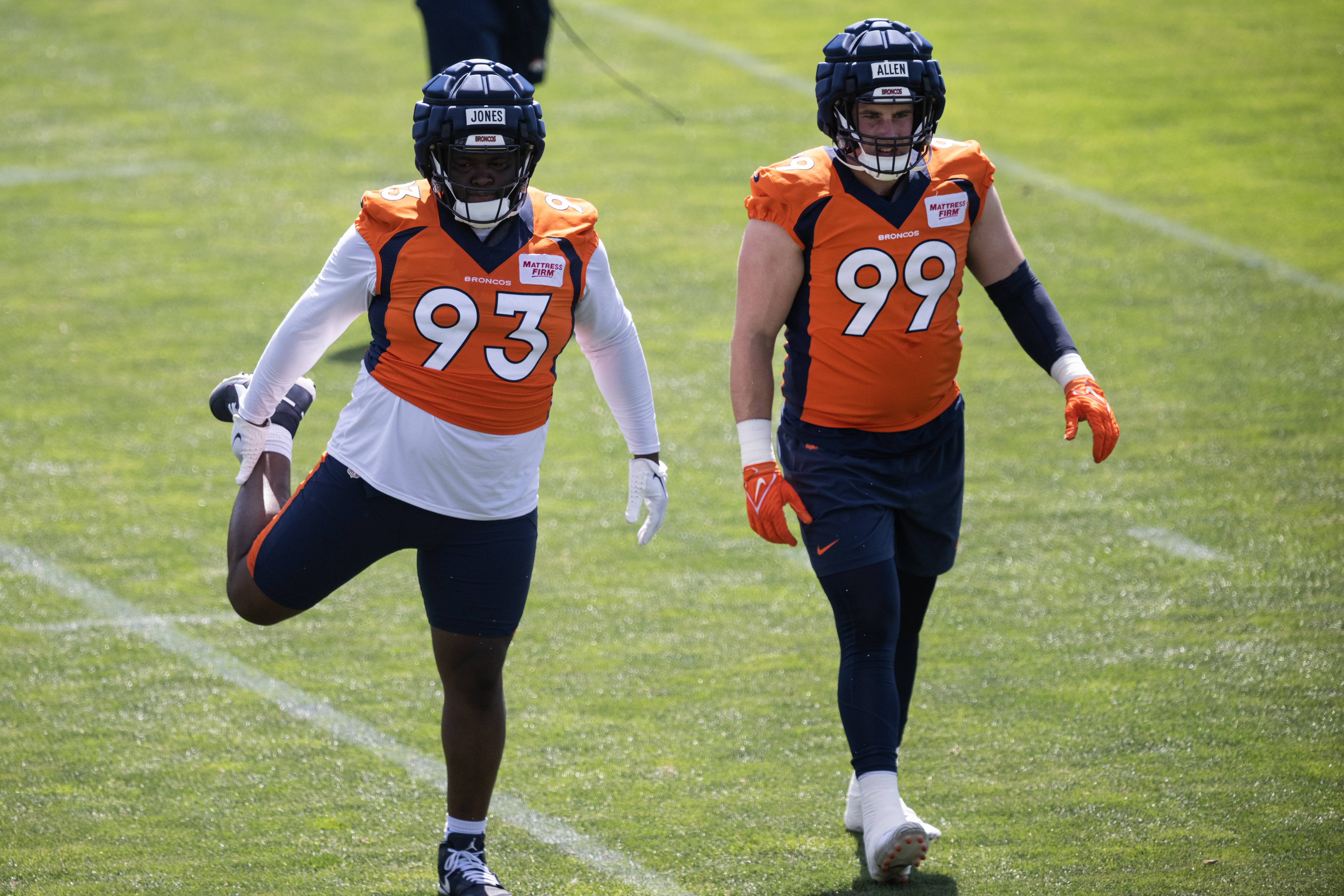 Denver Broncos defensive tackle D.J. Jones (93) and defensive end Zach Allen (99) stretch during training camp on Friday, July 28, 2023, at the Centura Health Training Center in Centennial, Colo. (Timothy Hurst/Denver Gazette) (TimHursttim.hurst@gazette.comhttps://secure.gravatar.com/avatar/aca82bd62b4ee425c598527cd6faa1b1?d=mm&r=g)