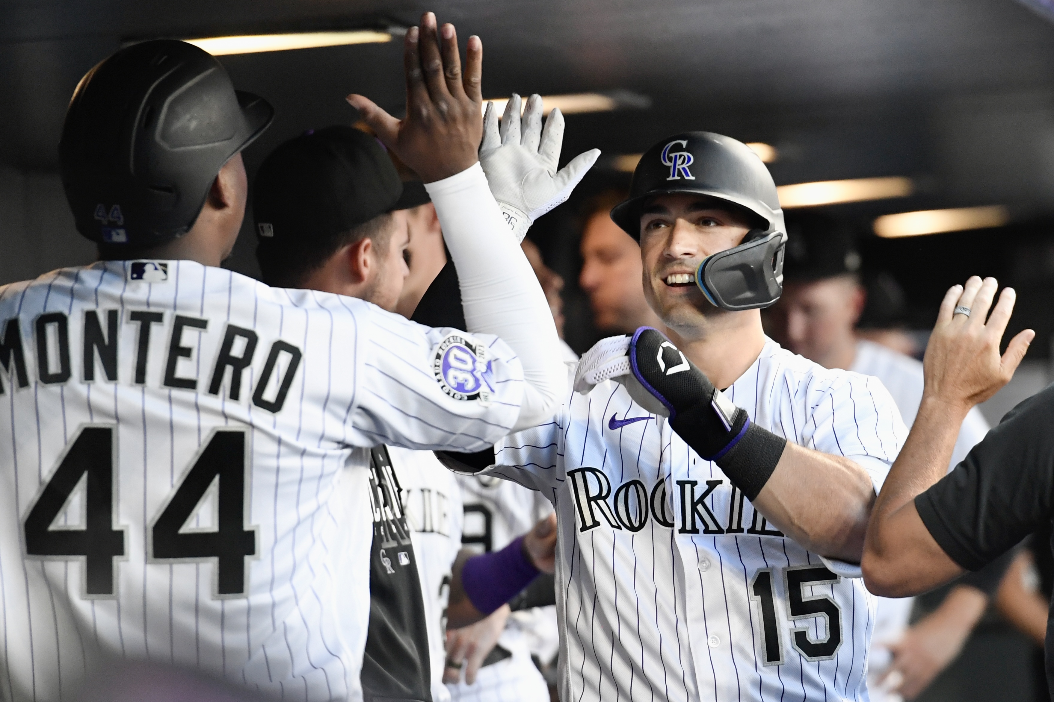 Randal Grichuk high-fives teammates after hitting a home run against the Oakland Athletics on Friday, July 28, 2023. (CarsonFieldcarson.field@gazette.comhttps://secure.gravatar.com/avatar/c524ef3d384945349bed78d70eb2d2cd?d=mm&r=g)