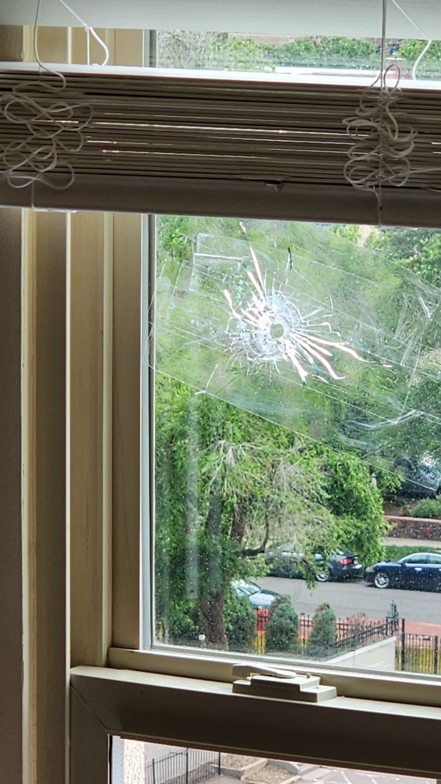 A stray bullet pierced a window of one of the upper units of The Beauvallon condominiums, off 9th and Lincoln streets in downtown Denver, on the afternoon of July 4. (Courtesy of Matt Garrett)