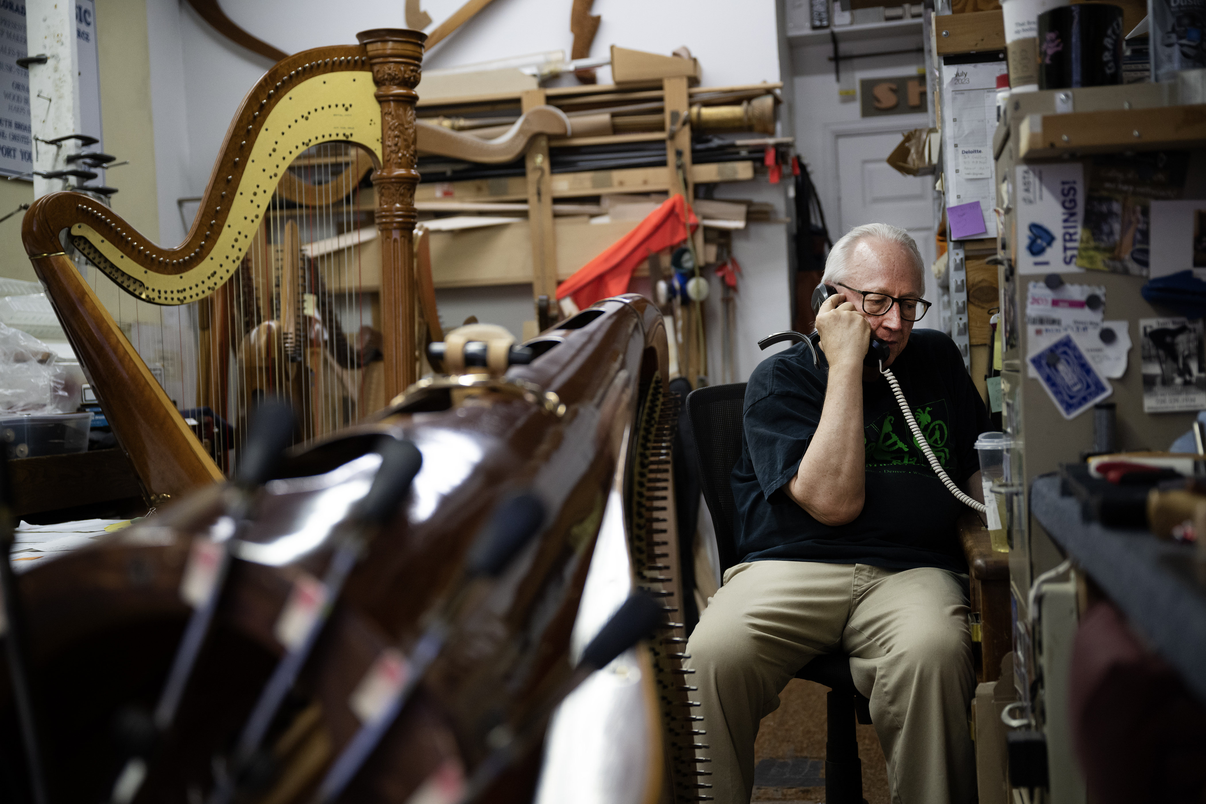 Co-owner David Kolacny takes a moment from working on a backlog of harp repairs and regulations to take a call on Monday, July 17, 2023, at Kolacny Music Co. in Denver, Colo. (Timothy Hurst/Denver Gazette) (TimHursttim.hurst@gazette.comhttps://secure.gravatar.com/avatar/aca82bd62b4ee425c598527cd6faa1b1?d=mm&r=g)