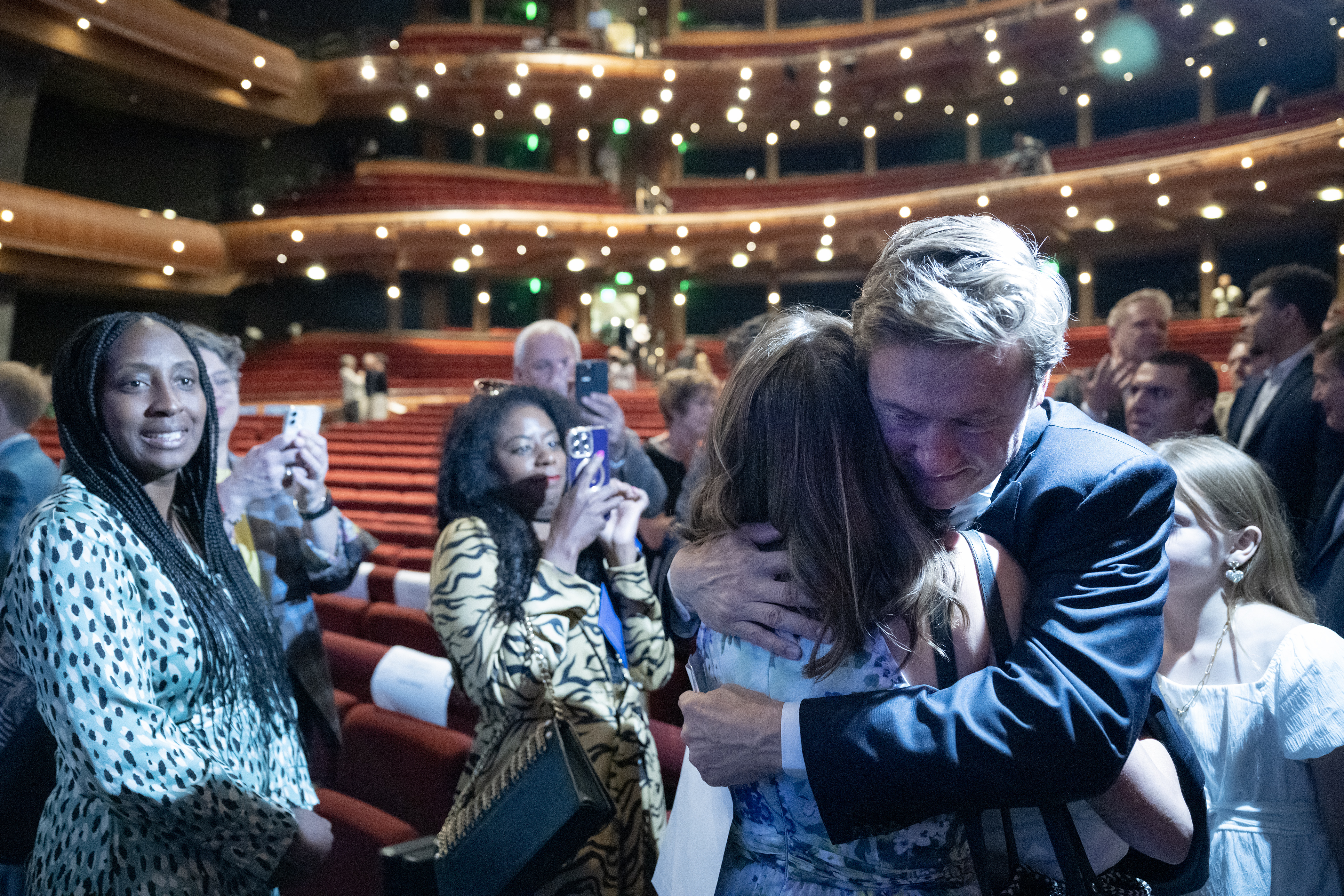 Denver mayor Mike Johnston hugs his wife Courtney after being sworn-in during the inauguration ceremony for city and county of Denver elected officials on Monday, July 17, 2023, at the Ellie Caulkins Opera House in Denver, Colo. (Timothy Hurst/Denver Gazette) (TimHursttim.hurst@gazette.comhttps://secure.gravatar.com/avatar/aca82bd62b4ee425c598527cd6faa1b1?d=mm&r=g)