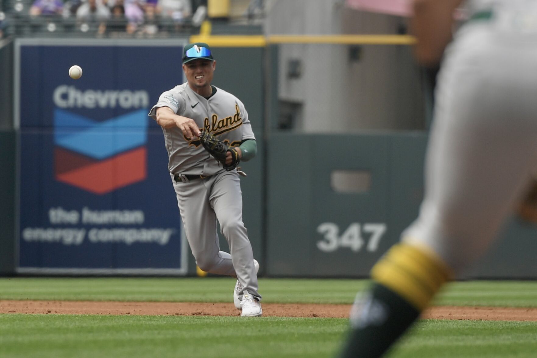 A's infielder Aledmys Diaz throws to first against the Rockies on Sunday, July 30, 2023. (CarsonFieldcarson.field@gazette.comhttps://secure.gravatar.com/avatar/c524ef3d384945349bed78d70eb2d2cd?d=mm&r=g)