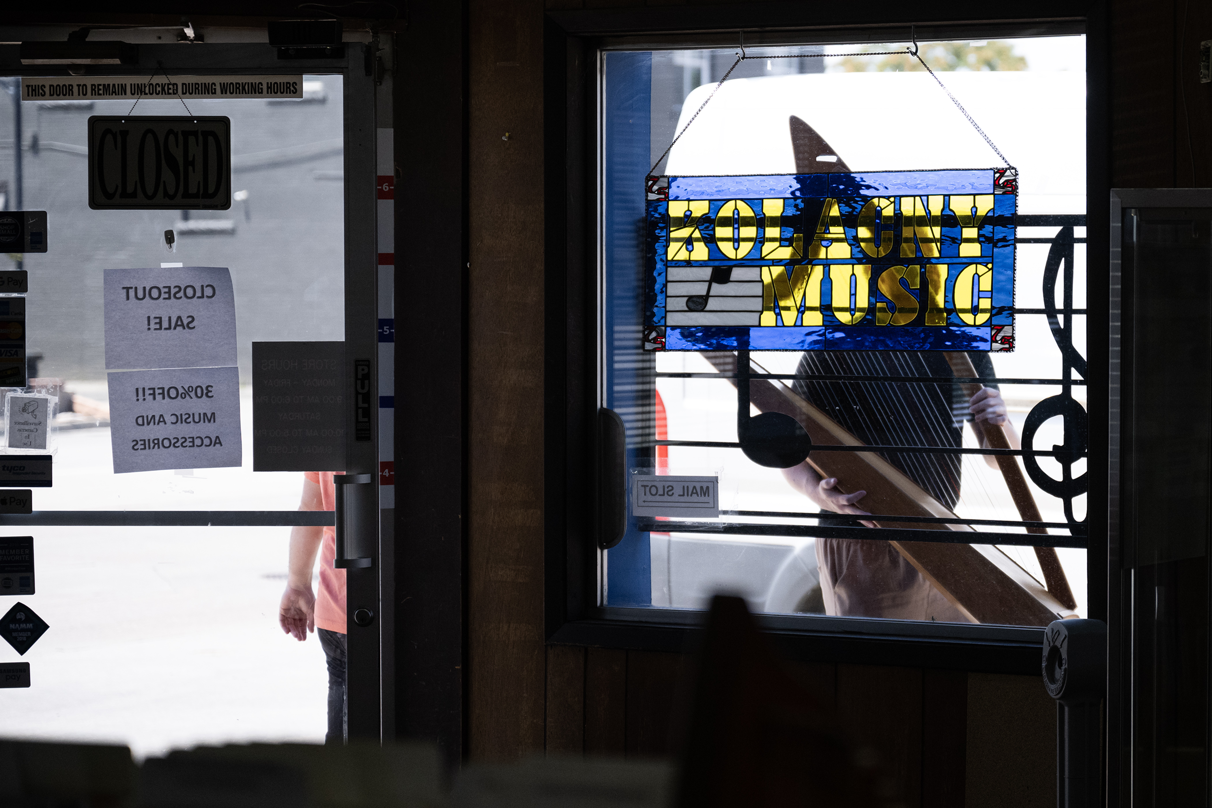 A customer carries his harp out of the store after having co-owner David Kolacny take a look at it on Monday, July 17, 2023, at Kolacny Music Co. in Denver, Colo. (Timothy Hurst/Denver Gazette) (TimHursttim.hurst@gazette.comhttps://secure.gravatar.com/avatar/aca82bd62b4ee425c598527cd6faa1b1?d=mm&r=g)