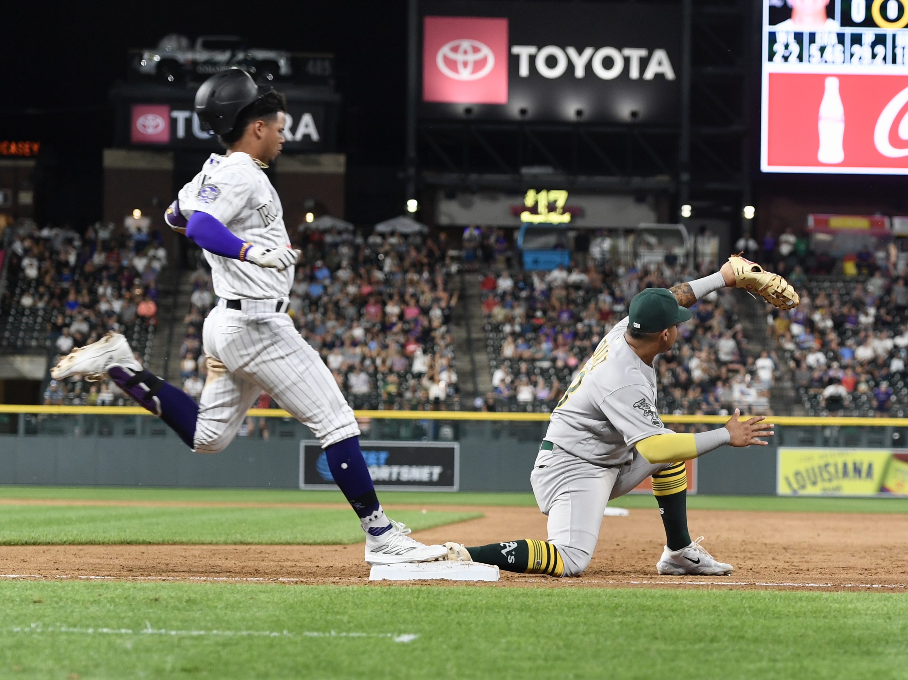 Rockies shortstop Ezequiel Tovar tries to beat a throw against the Oakland Athletics on Friday, July 28, 2023. (CarsonFieldcarson.field@gazette.comhttps://secure.gravatar.com/avatar/c524ef3d384945349bed78d70eb2d2cd?d=mm&r=g)