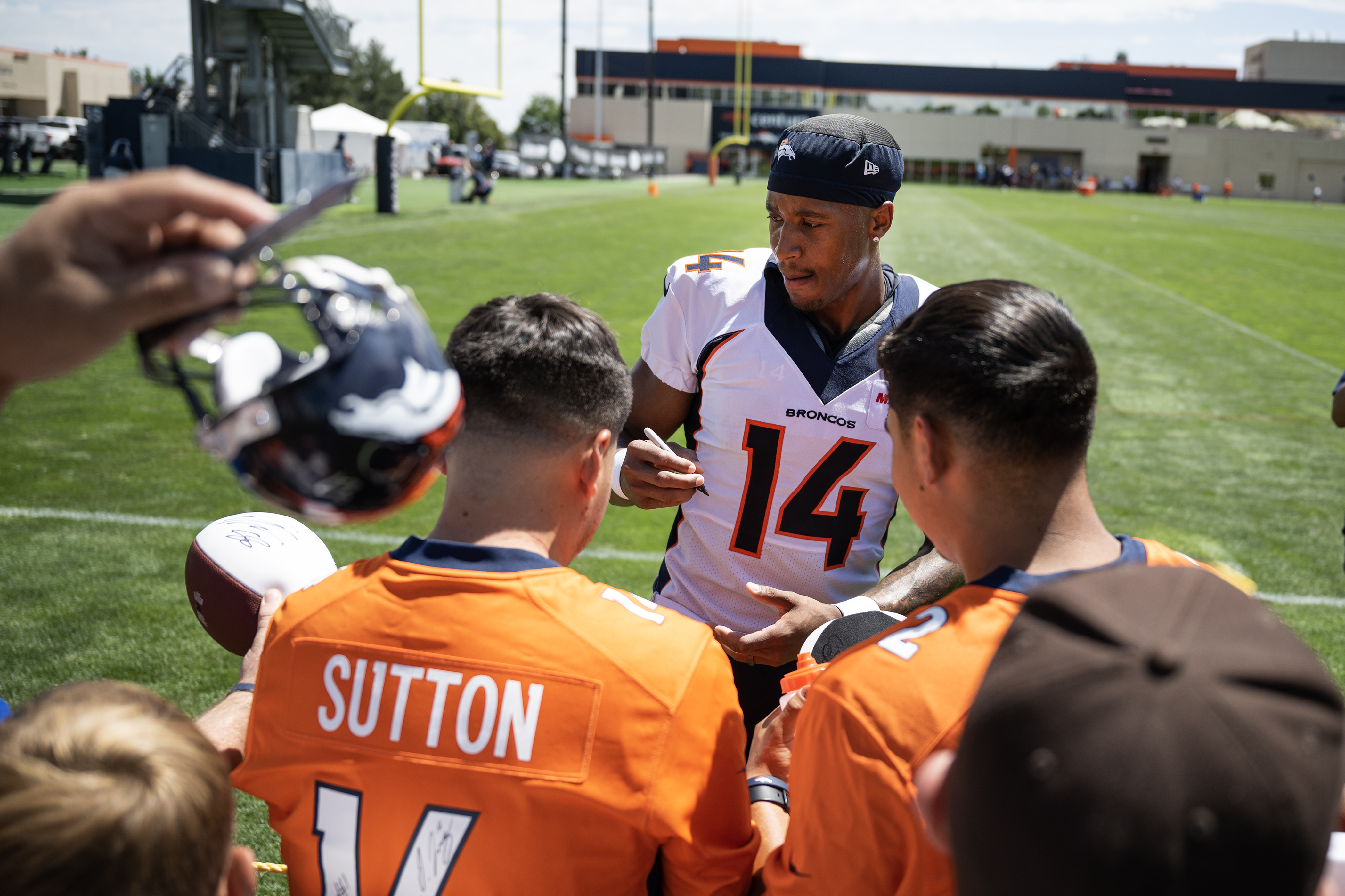 Denver Broncos wide receiver Courtland Sutton (14) signs autographs for fans after training camp on Friday, July 28, 2023, at the Centura Health Training Center in Centennial, Colo. (Timothy Hurst/Denver Gazette) (TimHursttim.hurst@gazette.comhttps://secure.gravatar.com/avatar/aca82bd62b4ee425c598527cd6faa1b1?d=mm&r=g)