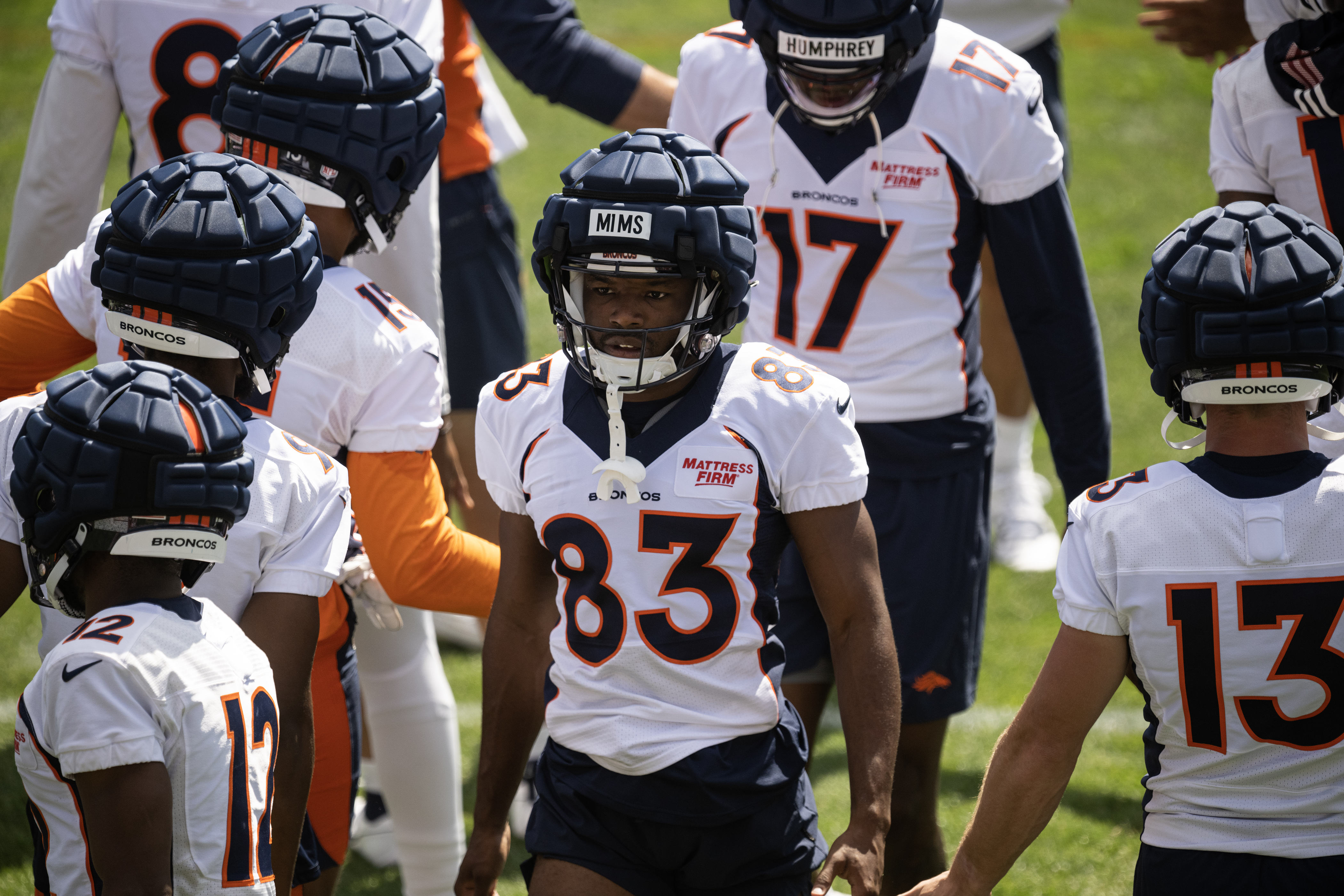 Denver Broncos rookie wide receiver Marvin Mims Jr. (83) walks through the crowd of teammates during stretches at training camp on Friday, July 28, 2023, at the Centura Health Training Center in Centennial, Colo. (Timothy Hurst/Denver Gazette) (TimHursttim.hurst@gazette.comhttps://secure.gravatar.com/avatar/aca82bd62b4ee425c598527cd6faa1b1?d=mm&r=g)