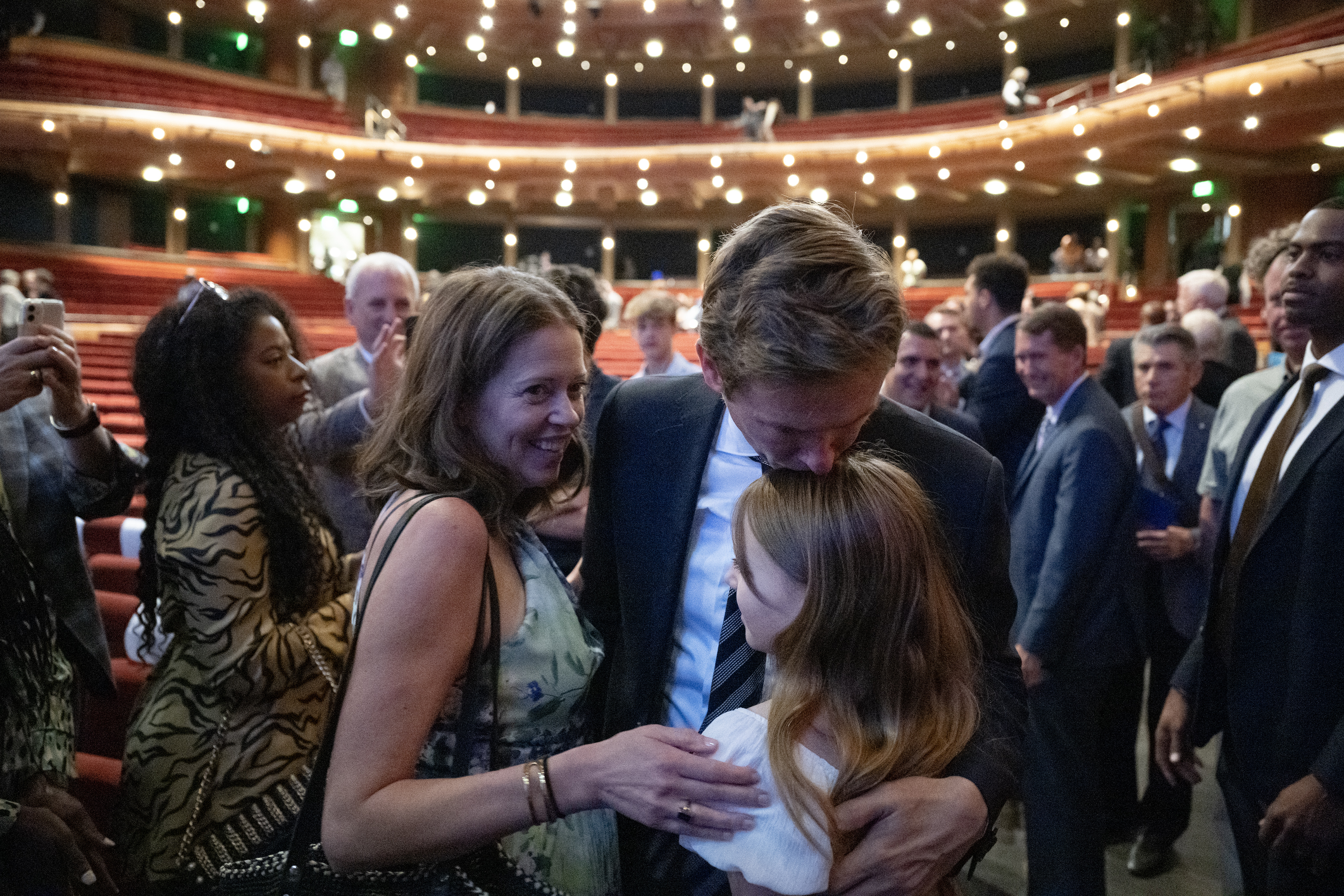 Denver mayor Mike Johnston kisses his daughter Ava and hugs his wife Courtney after being sworn-in during the inauguration ceremony for city and county of Denver elected officials on Monday, July 17, 2023, at the Ellie Caulkins Opera House in Denver, Colo. (Timothy Hurst/Denver Gazette) (Timothy Hurst/Denver Gazette)