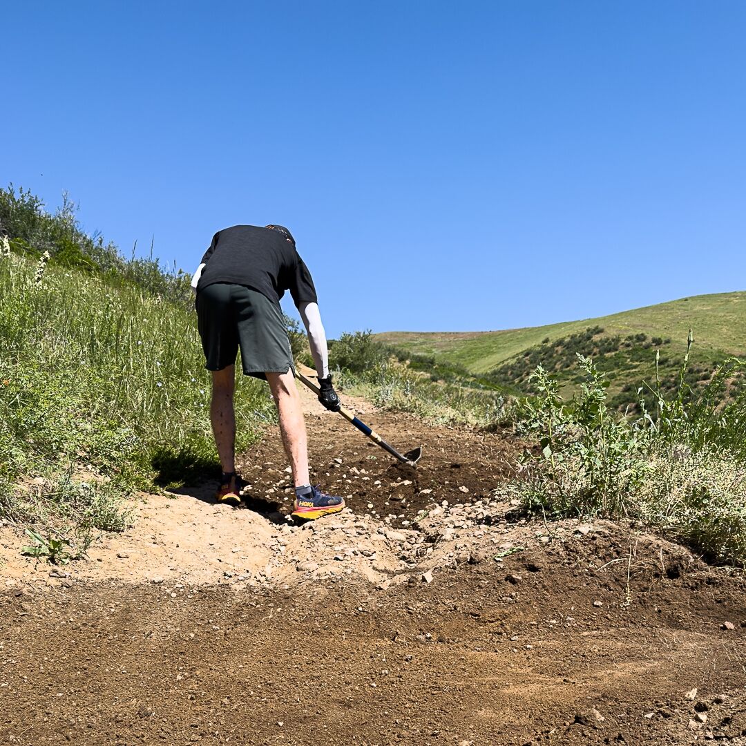 A man shovels dirt on a trail at Green Mountain Open Space while working with the Front Range Trails Conservancy at a volunteer trail maintenance day in Spring 2023. (Courtesy of Front Range Trails Conservancy)