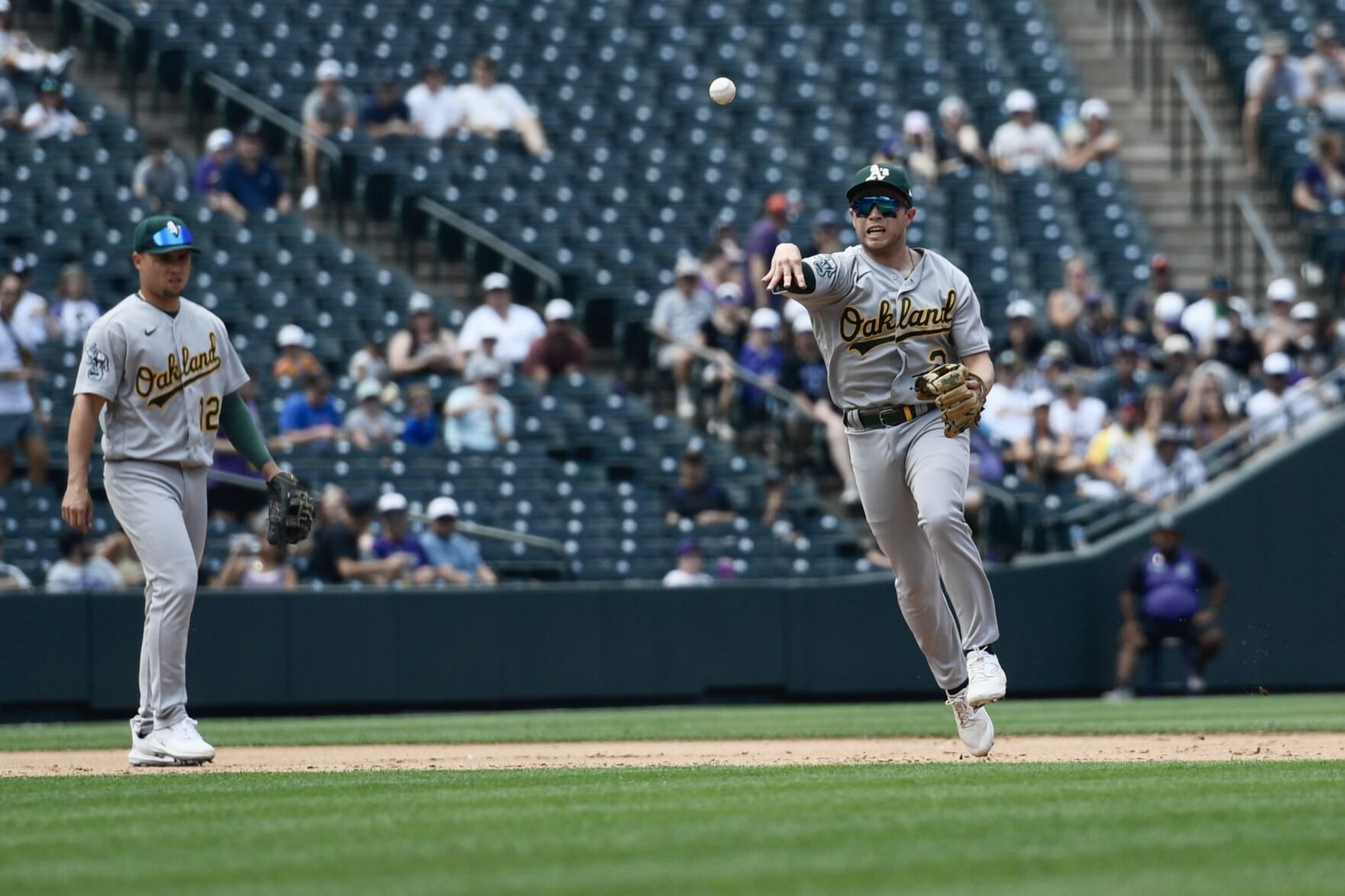 A's infielder Nick Allen throws to first against the Rockies on Sunday, July 30, 2023. (CarsonFieldcarson.field@gazette.comhttps://secure.gravatar.com/avatar/c524ef3d384945349bed78d70eb2d2cd?d=mm&r=g)