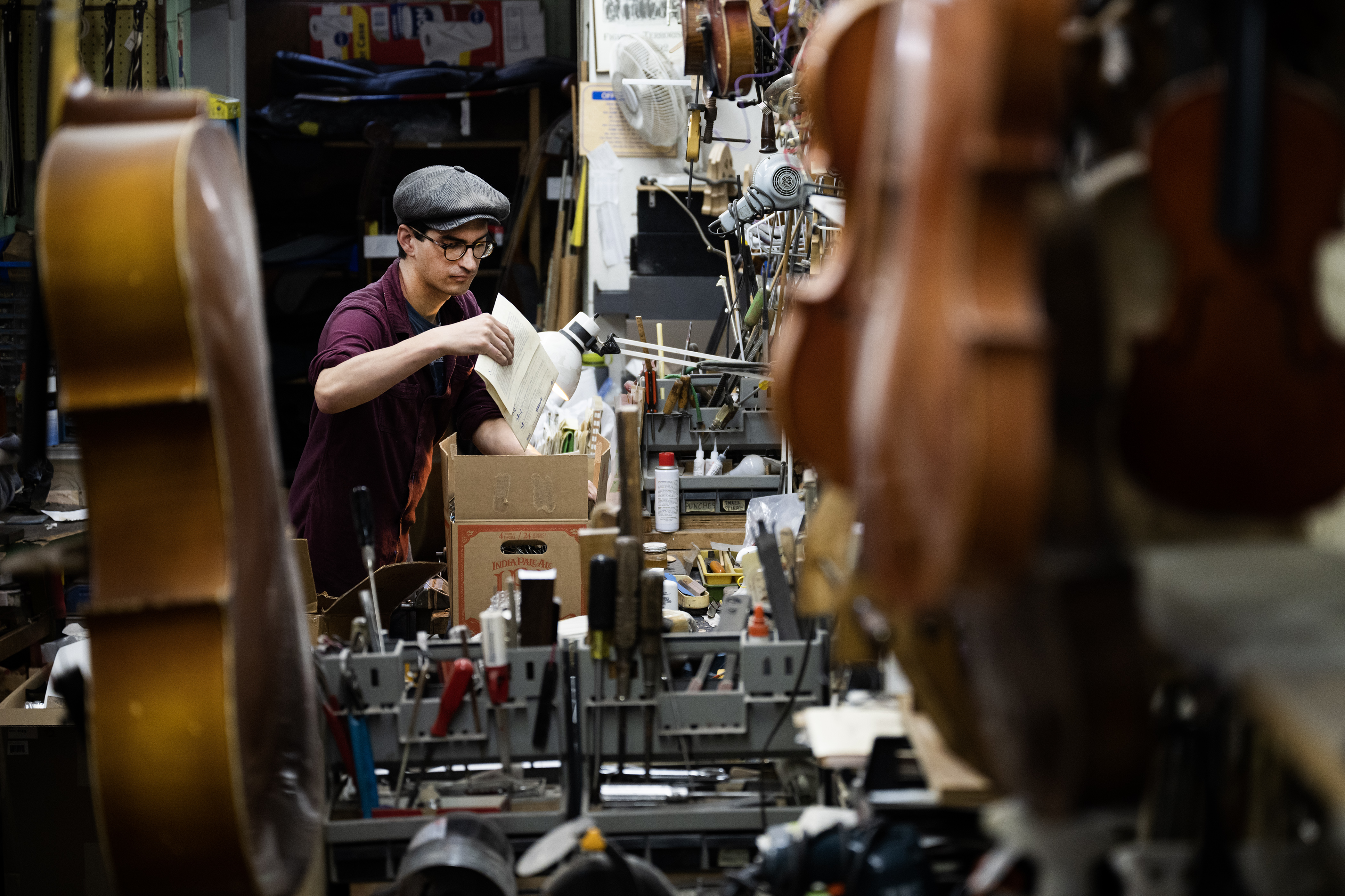 String repair specialist Eli Acosta goes through and packs up over 90 years of repair materials on Monday, July 17, 2023, at Kolacny Music in Denver, Colo. (Timothy Hurst/Denver Gazette) (TimHursttim.hurst@gazette.comhttps://secure.gravatar.com/avatar/aca82bd62b4ee425c598527cd6faa1b1?d=mm&r=g)