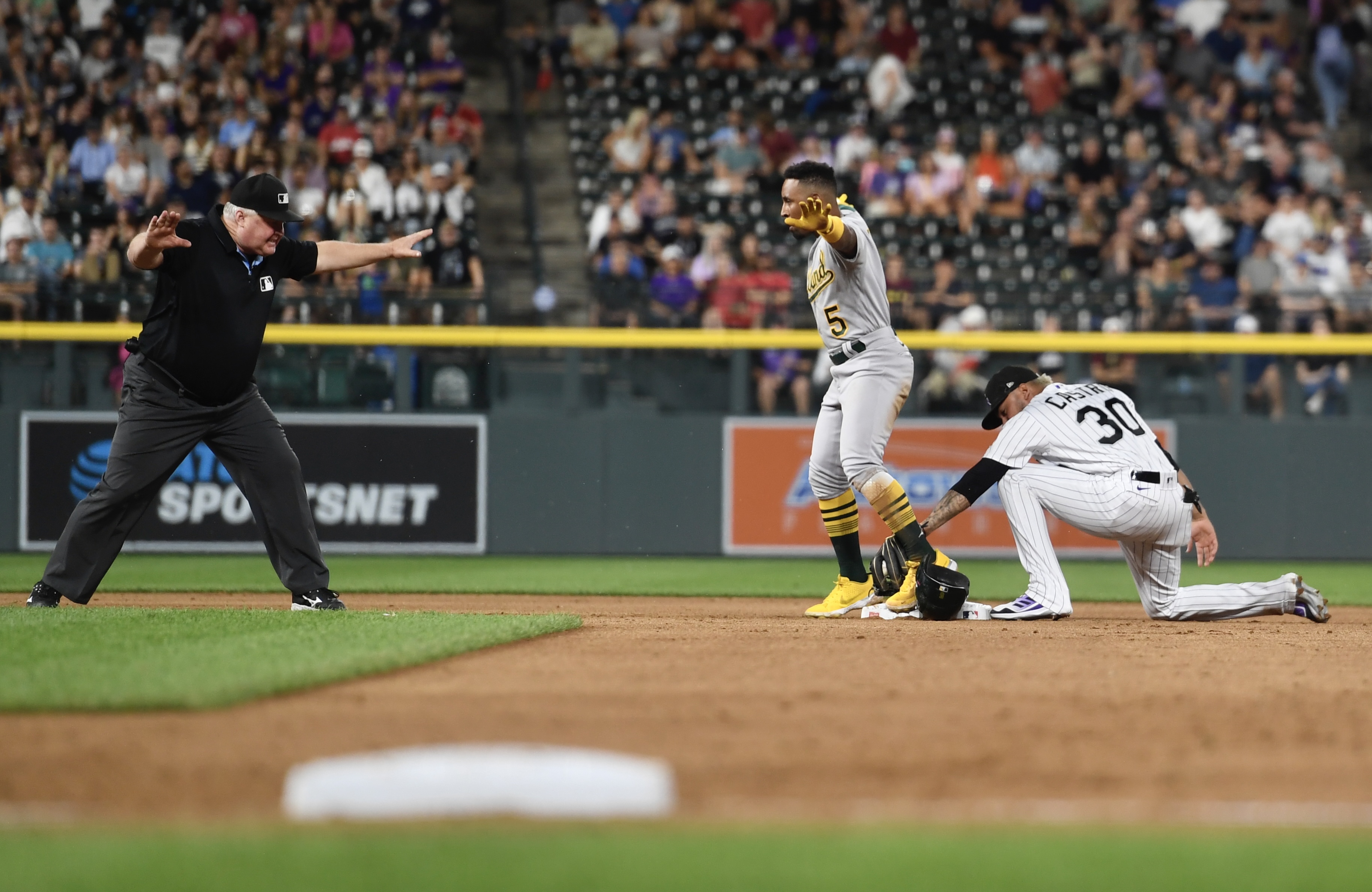 A's outfielder Tony Kemp beats a tag from Harold Castro at second base on Friday, July 28, 2023. (CarsonFieldcarson.field@gazette.comhttps://secure.gravatar.com/avatar/c524ef3d384945349bed78d70eb2d2cd?d=mm&r=g)