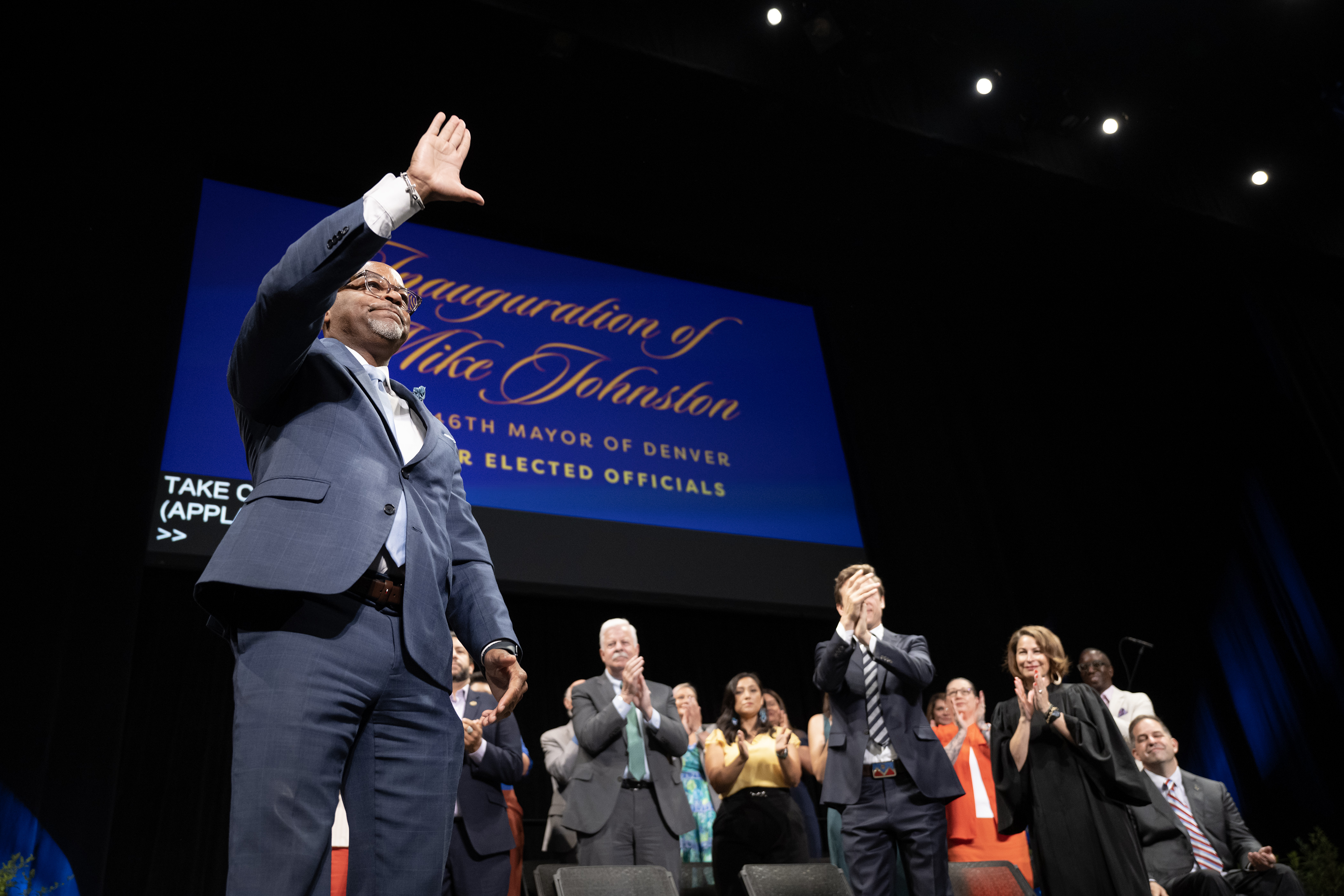 Outgoing Denver mayor Michael Hancock waves to the crowd as he receives a standing ovation after giving his remarks during the inauguration ceremony for newly-elected Denver mayor Mike Johnston on Monday, July 17, 2023, at the Ellie Caulkins Opera House in Denver, Colo. (Timothy Hurst/Denver Gazette) (TimHursttim.hurst@gazette.comhttps://secure.gravatar.com/avatar/aca82bd62b4ee425c598527cd6faa1b1?d=mm&r=g)