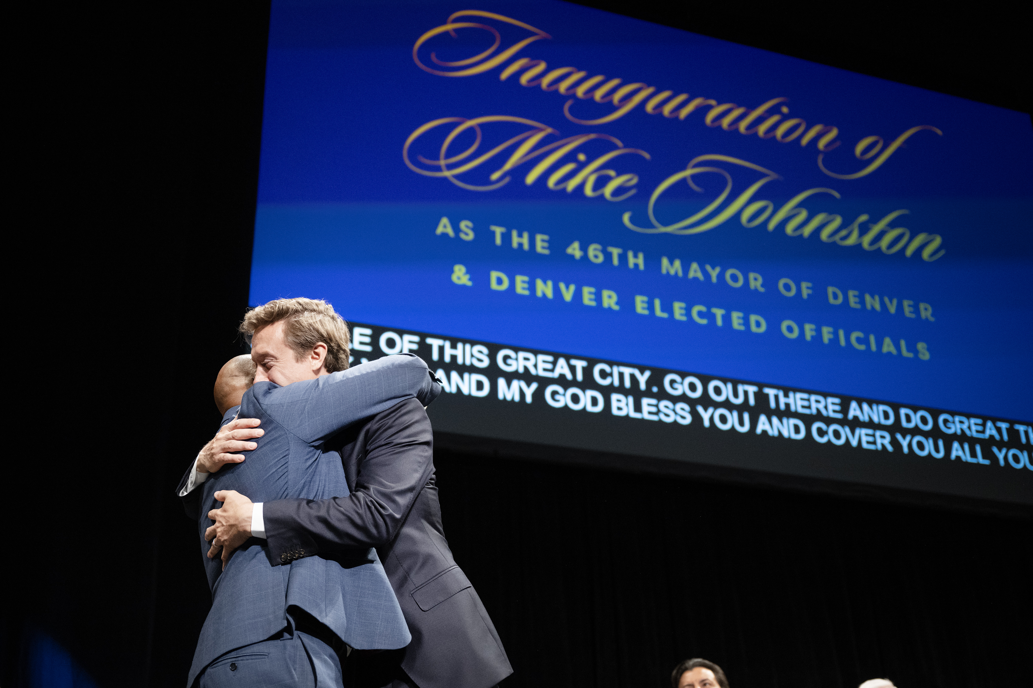 Denver mayor Mike Johnston, right, hugs outgoing term-limited mayor Michael Hancock after Hancock’s speech during the inauguration ceremony for city and county of Denver elected officials on Monday, July 17, 2023, at the Ellie Caulkins Opera House in Denver, Colo. (Timothy Hurst/Denver Gazette) (TimHursttim.hurst@gazette.comhttps://secure.gravatar.com/avatar/aca82bd62b4ee425c598527cd6faa1b1?d=mm&r=g)