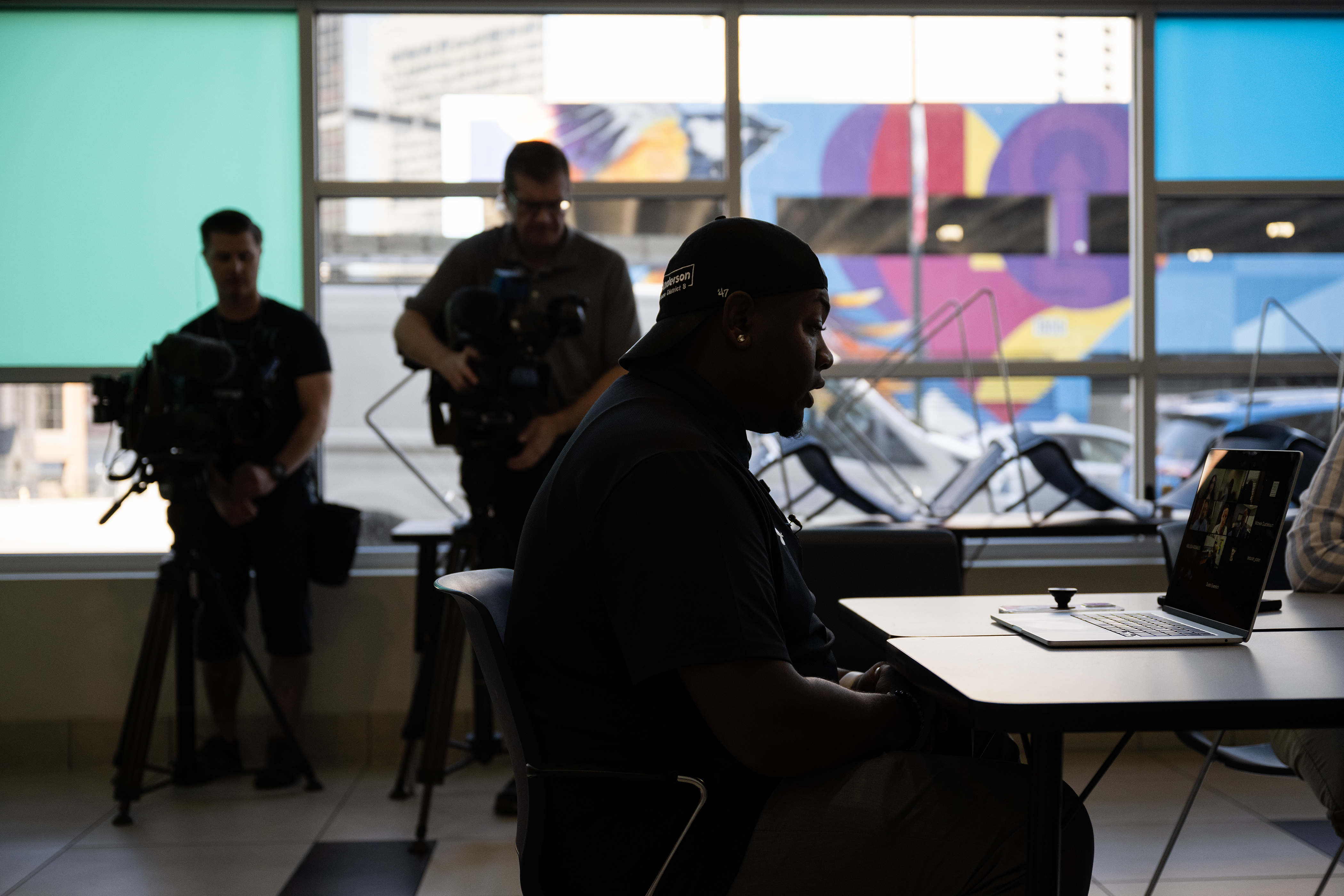 Denver Public Schools Board of Education vice president Auon'tai Anderson, center, flanked by local media members, listens in during a virtual Board of Education Special Board Meeting to discuss and vote on the release of a recording of a closed-door meeting the day after the March 22 shooting at East High School, on Friday, July 21, 2023, in Denver, Colo. (Timothy Hurst/Denver Gazette) (TimHursttim.hurst@gazette.comhttps://secure.gravatar.com/avatar/aca82bd62b4ee425c598527cd6faa1b1?d=mm&r=g)