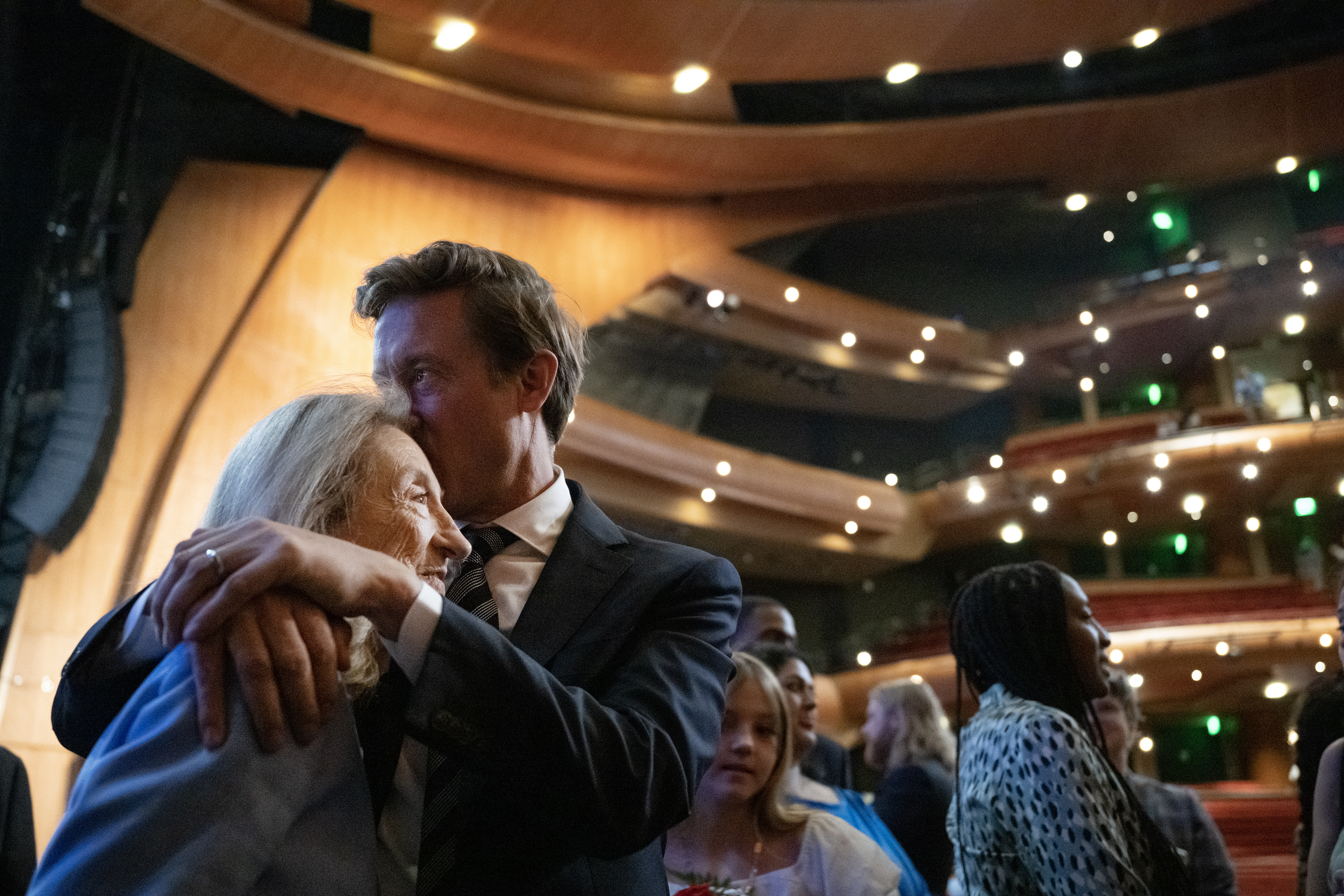 Denver mayor Mike Johnston hugs and kisses his mother Sally after being sworn-in during the inauguration ceremony for city and county of Denver elected officials on Monday, July 17, 2023, at the Ellie Caulkins Opera House in Denver, Colo. (Timothy Hurst/Denver Gazette) (TimHursttim.hurst@gazette.comhttps://secure.gravatar.com/avatar/aca82bd62b4ee425c598527cd6faa1b1?d=mm&r=g)