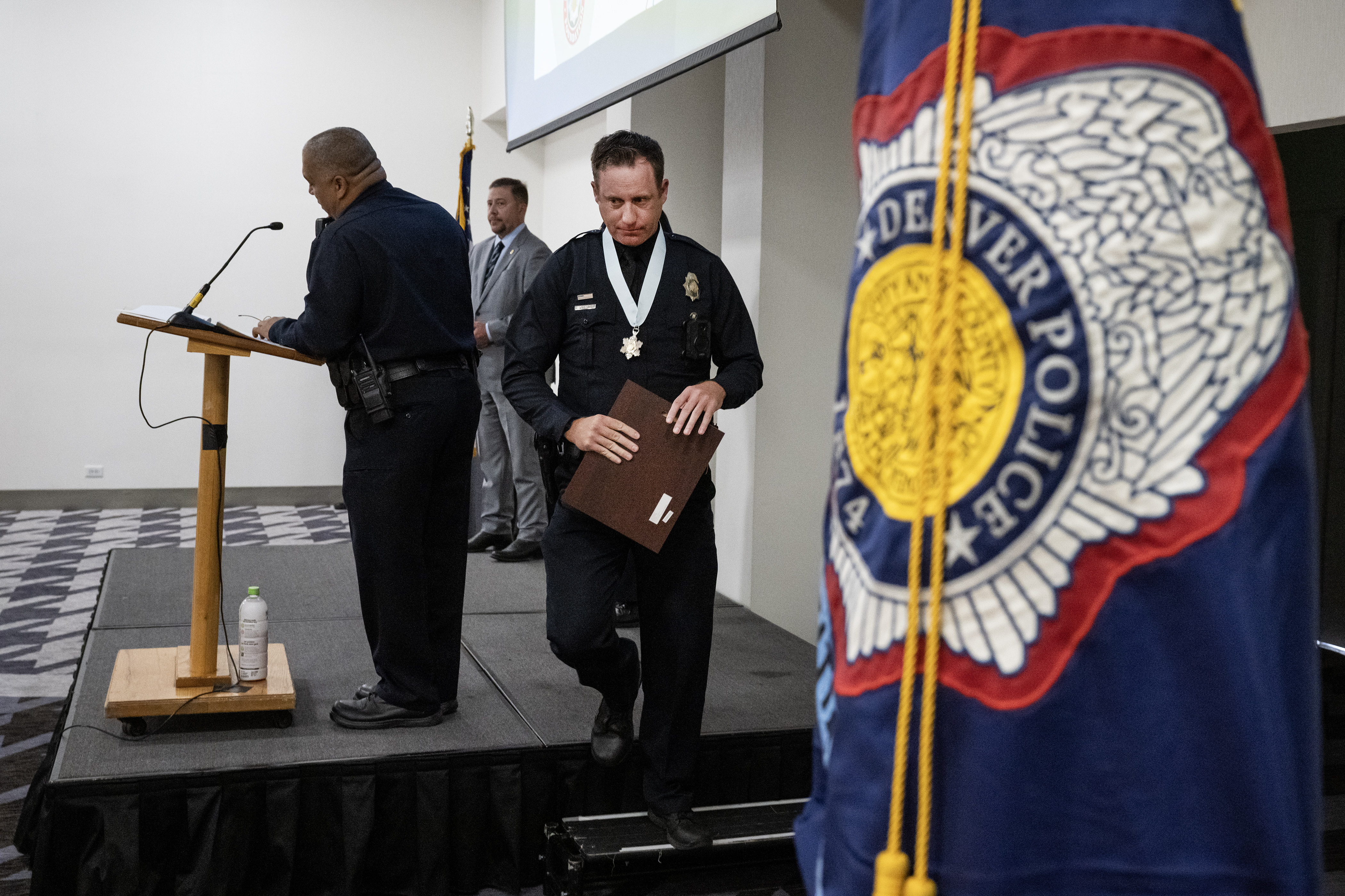 Denver Police Department officer Kelly Boyd leaves the stage after being awarded the Medal of Valor during the Denver Police Foundation Award Ceremony on Monday, July 24, 2023, at The Curtis Hotel in Denver, Colo. (Timothy Hurst/Denver Gazette) (TimHursttim.hurst@gazette.comhttps://secure.gravatar.com/avatar/aca82bd62b4ee425c598527cd6faa1b1?d=mm&r=g)