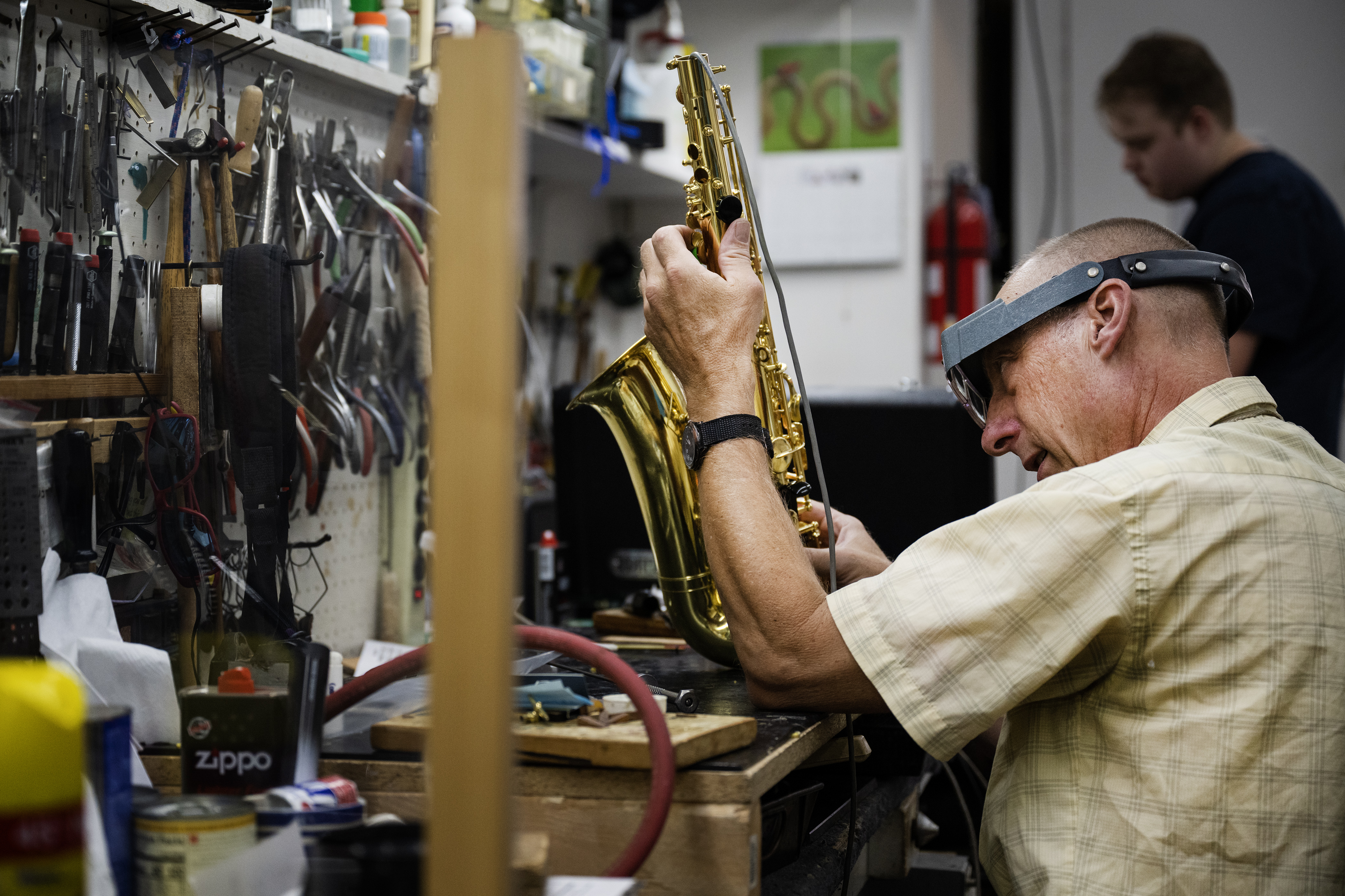 Repair technician Matt Curtischecks re-pads, adjusts keys and checks for leaks on an alto saxophone in the brass repair shop on Monday, July 17, 2023, at Kolacny Music Co. in Denver, Colo. (Timothy Hurst/Denver Gazette) (TimHursttim.hurst@gazette.comhttps://secure.gravatar.com/avatar/aca82bd62b4ee425c598527cd6faa1b1?d=mm&r=g)