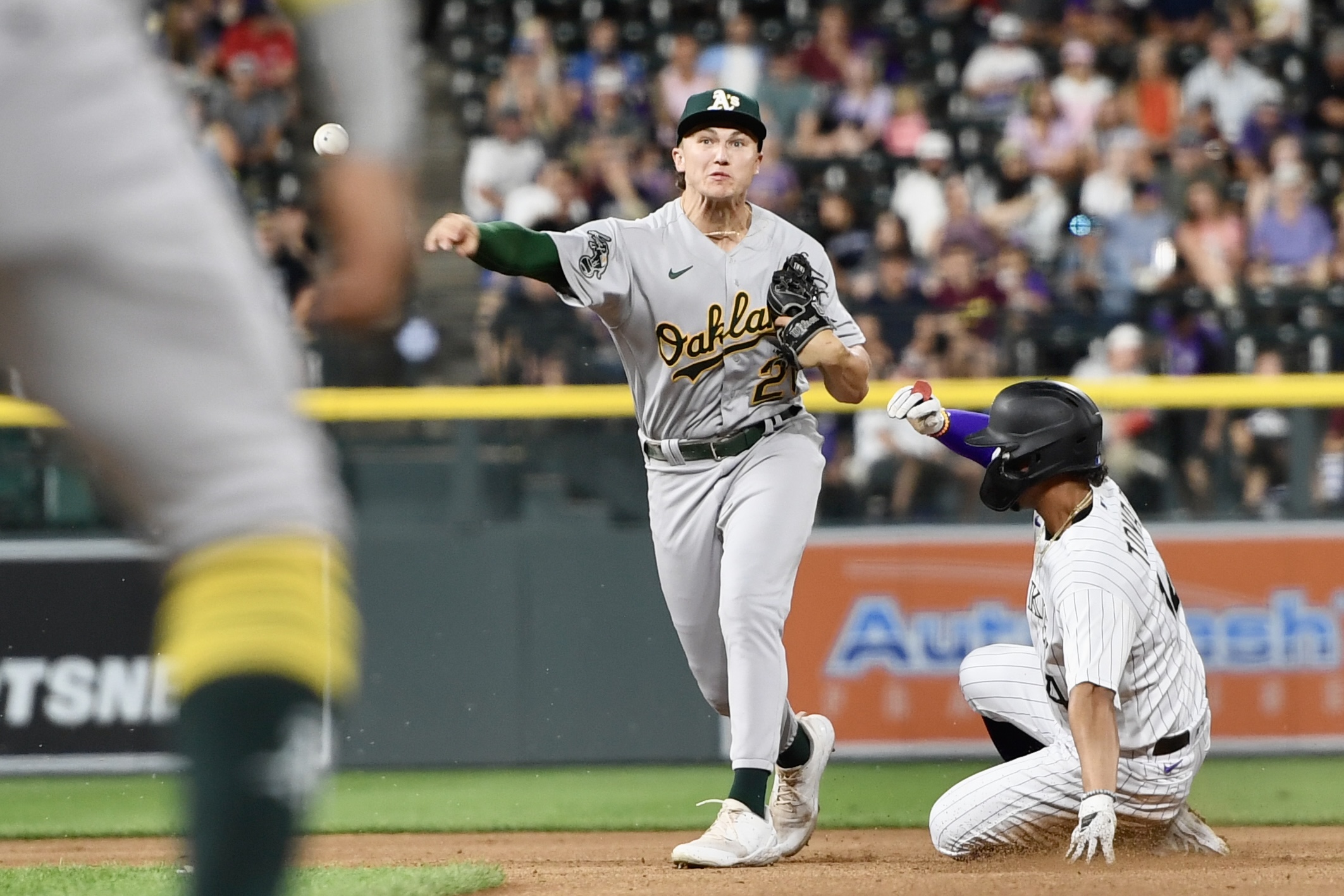 Athletics infielder Zack Gelof tries for a double play as Rockies shortstop Ezequiel Tovar slides into second base on Friday, July 28, 2023. (CarsonFieldcarson.field@gazette.comhttps://secure.gravatar.com/avatar/c524ef3d384945349bed78d70eb2d2cd?d=mm&r=g)