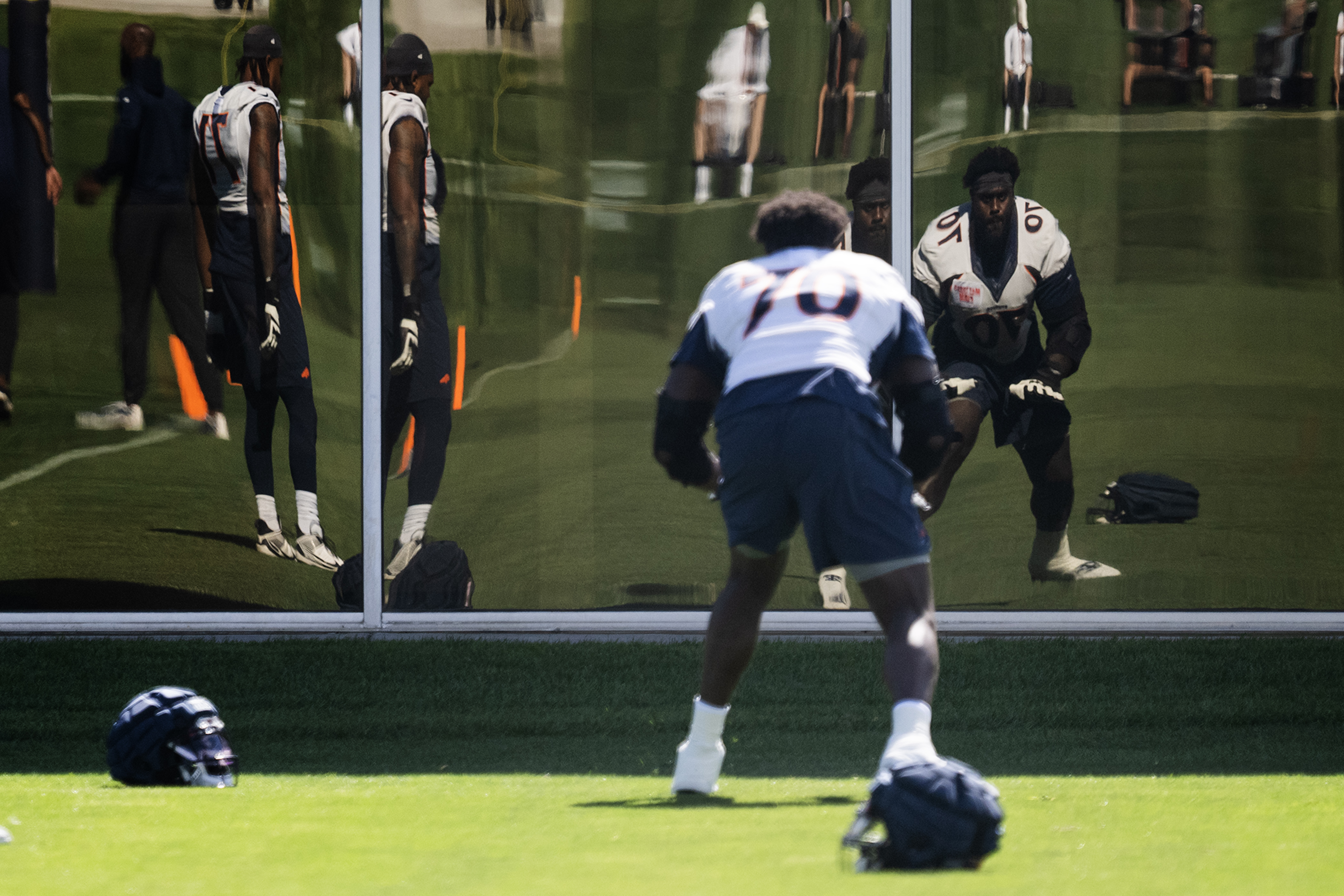 Denver Broncos tackle Isaiah Prince (70) does drills while using a window as a mirror during training camp on Friday, July 28, 2023, at the Centura Health Training Center in Centennial, Colo. (Timothy Hurst/Denver Gazette) (TimHursttim.hurst@gazette.comhttps://secure.gravatar.com/avatar/aca82bd62b4ee425c598527cd6faa1b1?d=mm&r=g)