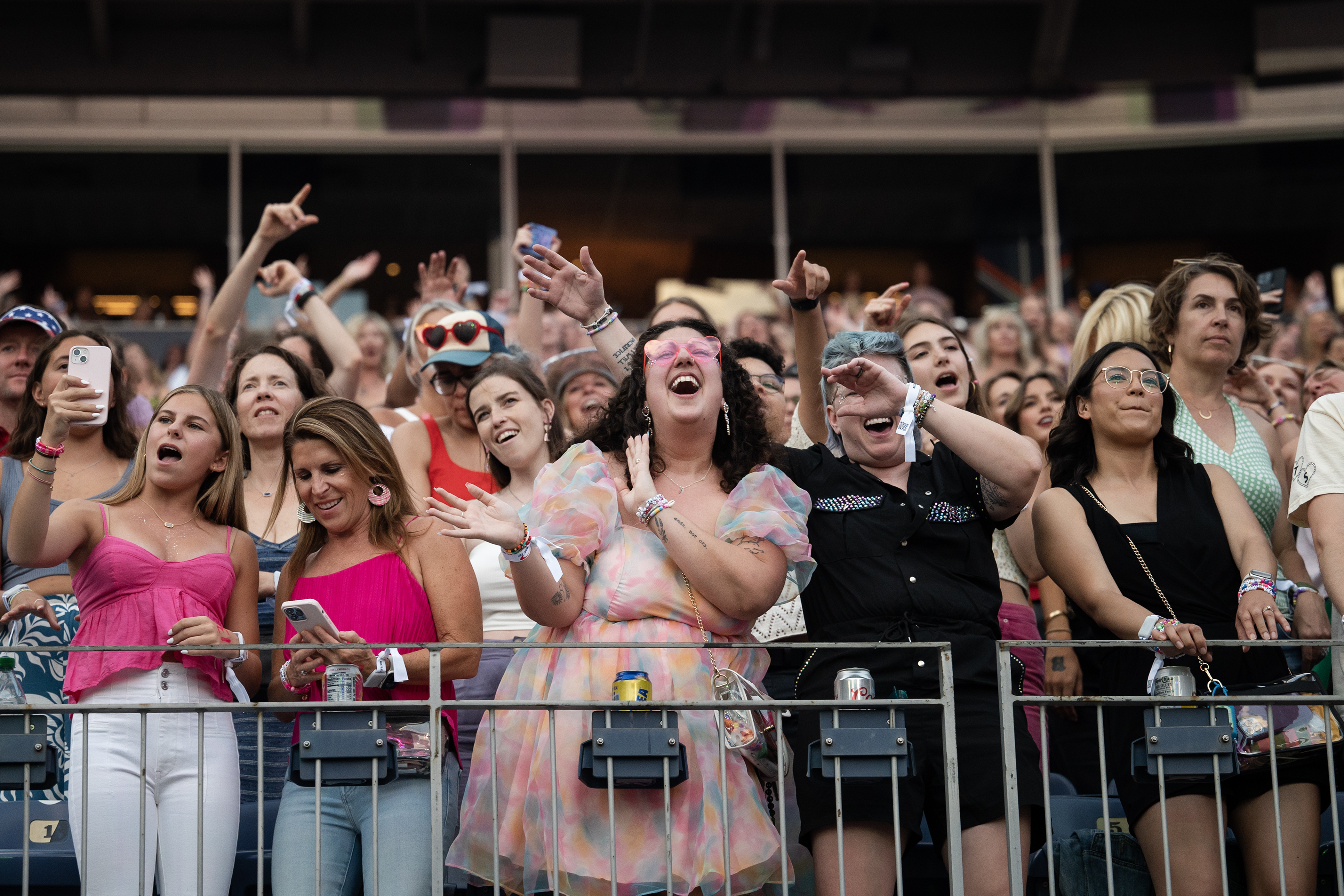Fans react as Taylor Swift performs during the first of two shows at Empower Field at Mile High for The Eras Tour on Friday, July 14, 2023, in Denver, Colo. (Timothy Hurst/Denver Gazette) (TimHursttim.hurst@gazette.comhttps://secure.gravatar.com/avatar/aca82bd62b4ee425c598527cd6faa1b1?d=mm&r=g)