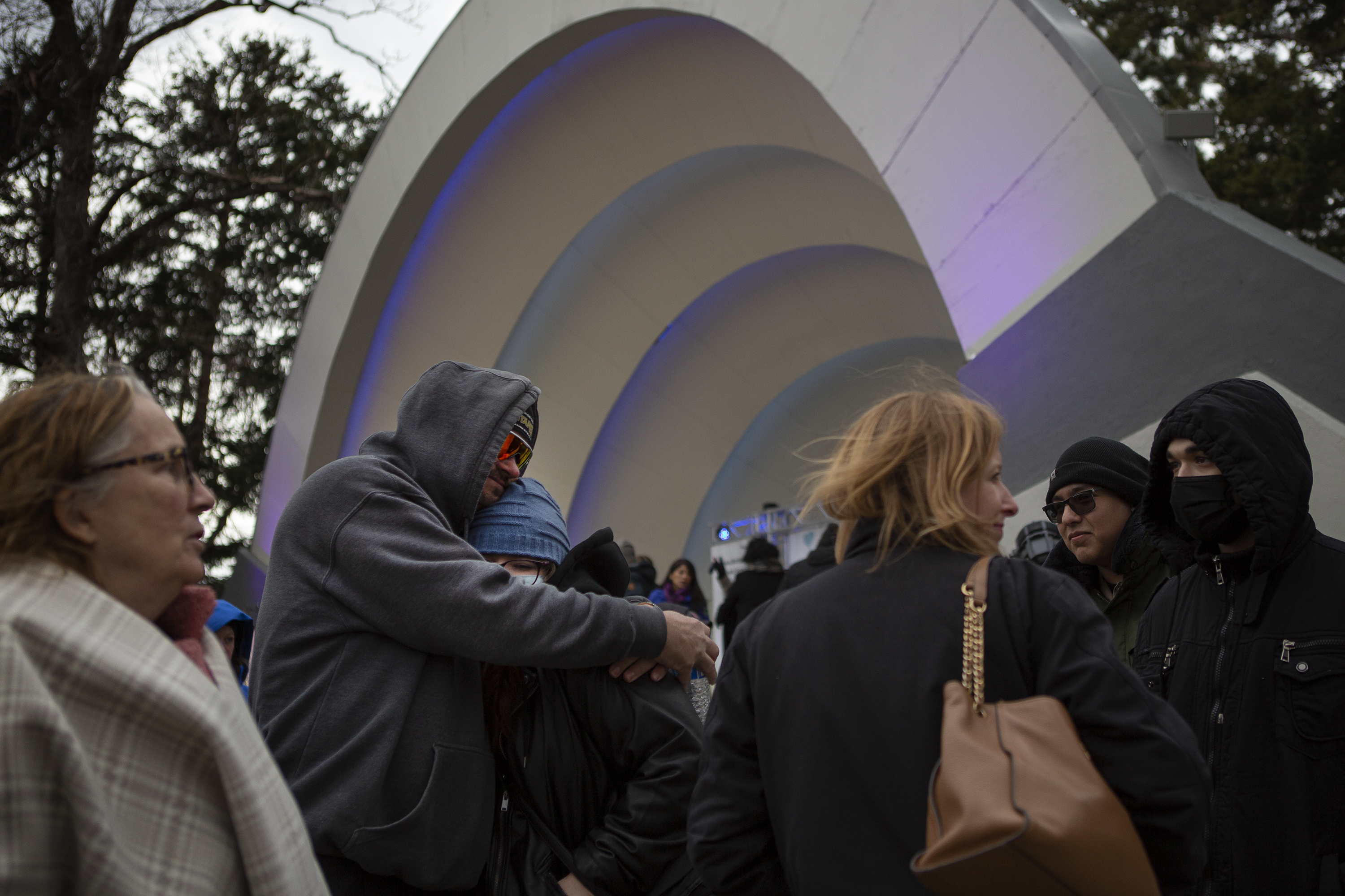 FILE PHOTO: Robert Olds hugs MiaBella DiFiore, the uncle and cousin of Rikki Olds, one of the ten victims of a mass shooting at the King Soopers one year ago, after a Communitywide Day of Remembrance gathering at the Glen Huntington Bandshell on Tuesday, March 22, 2022, in Boulder, Colo. (Timothy Hurst/The Denver Gazette) (Timothy Hurst)