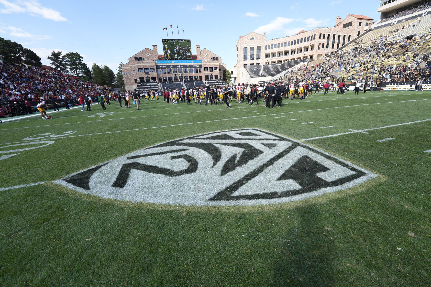 PAC12 logo on the surface of Folsom Field in the second half of an NCAA college football game Saturday, Oct. 2, 2021, in Boulder, Colo. Southern California won 37-14. (AP Photo/David Zalubowski) (David Zalubowski)