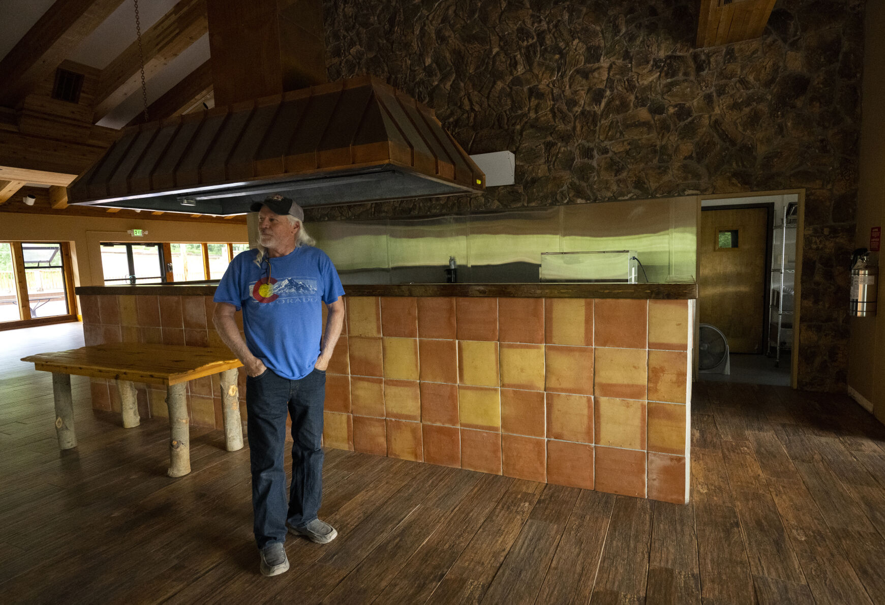 Chris Smith stands inside the renovated old lodge at Cuchara Mountain Ski Resort Tuesday, Aug. 1, 2023. He bought it and now books it for weddings and special events. (The Gazette, Christian Murdock) (Christian Murdock/The Gazette)