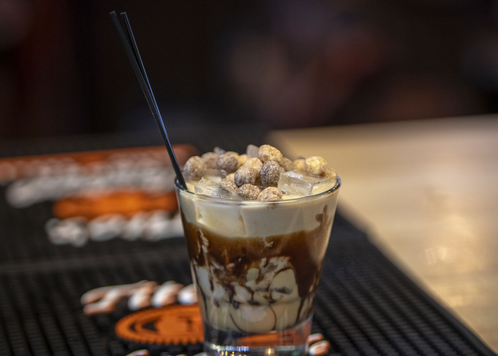 One of Lebowski’s Taproom’s 9 White Russians features peanut butter cereal and a chocolate and caramel glazed glass at Lebowski's Taproom in Colorado Springs, Colo. on Wednesday, August 23, 2023. (Gabi Broekema)