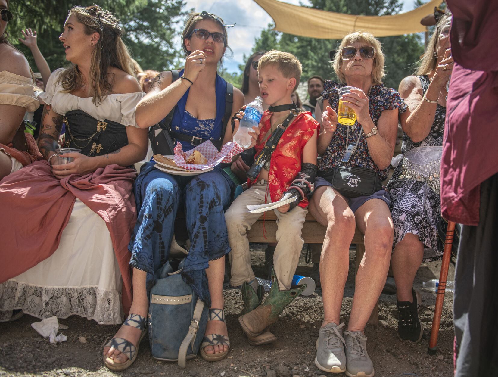 FILE PHOTO: Attendees await the start of Cydeshow Cy’s swordswallowing act at the Colorado Renaissance Festival in Colorado Springs, Co., on Saturday, July 29, 2023. The 2:00 show presented a unique showing experience; performer Cyrus Pynn attempting to claim a Guinness World Record. (Gabi Broekema/The Gazette)
