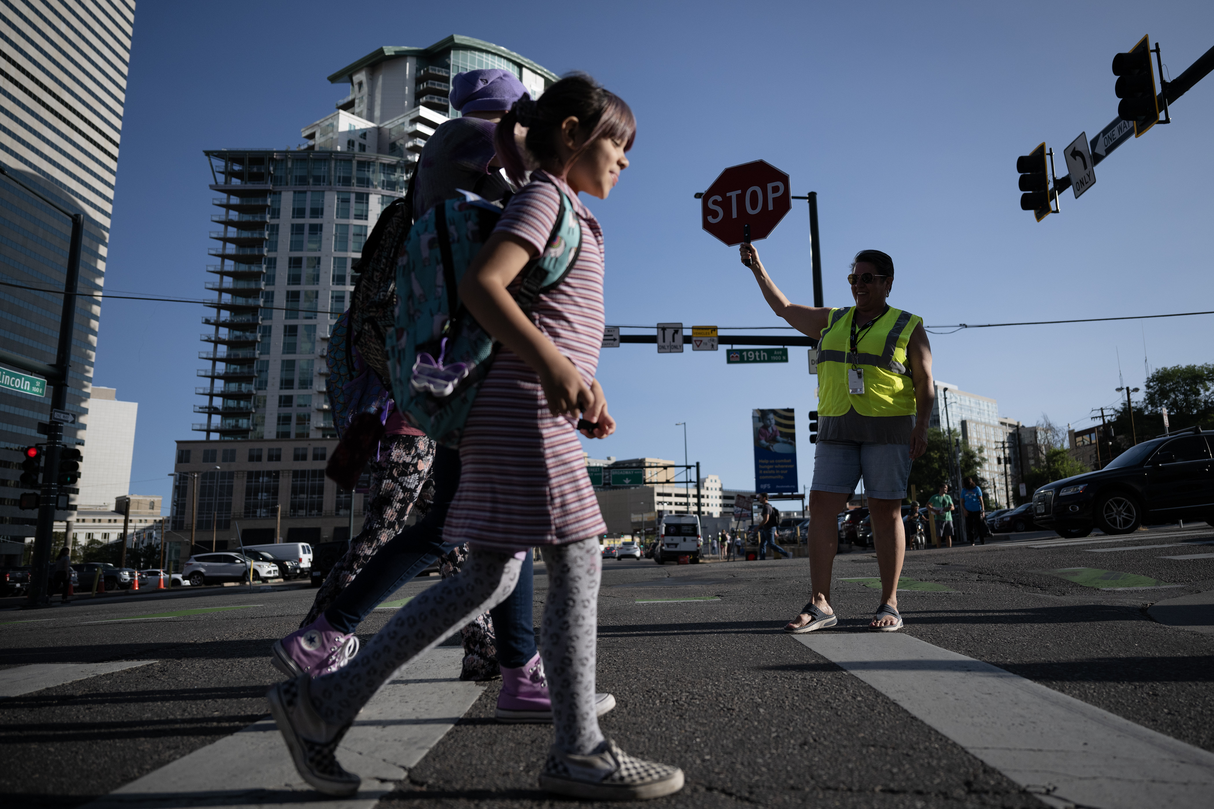 Crossing Guard Alison Torvik greets students and parents during the first day of Denver Public School’s Fall semester on Monday, Aug. 21, 2023, at Downtown Denver Expeditionary School in Denver, Colo.(Timothy Hurst/Denver Gazette) (TimHursttim.hurst@gazette.comhttps://secure.gravatar.com/avatar/aca82bd62b4ee425c598527cd6faa1b1?d=mm&r=g)