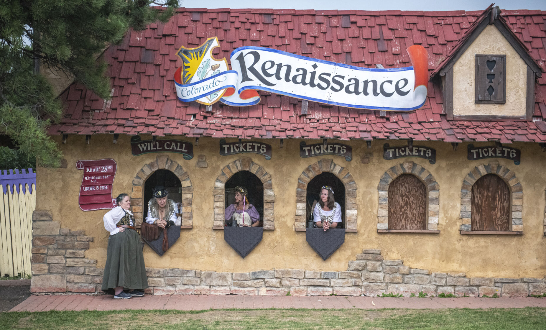 The ticket attendants relax as they near the end of the day at the Colorado Renaissance Festival in Colorado Springs, Co., on Saturday, July 29, 2023. (Gabi Broekema)