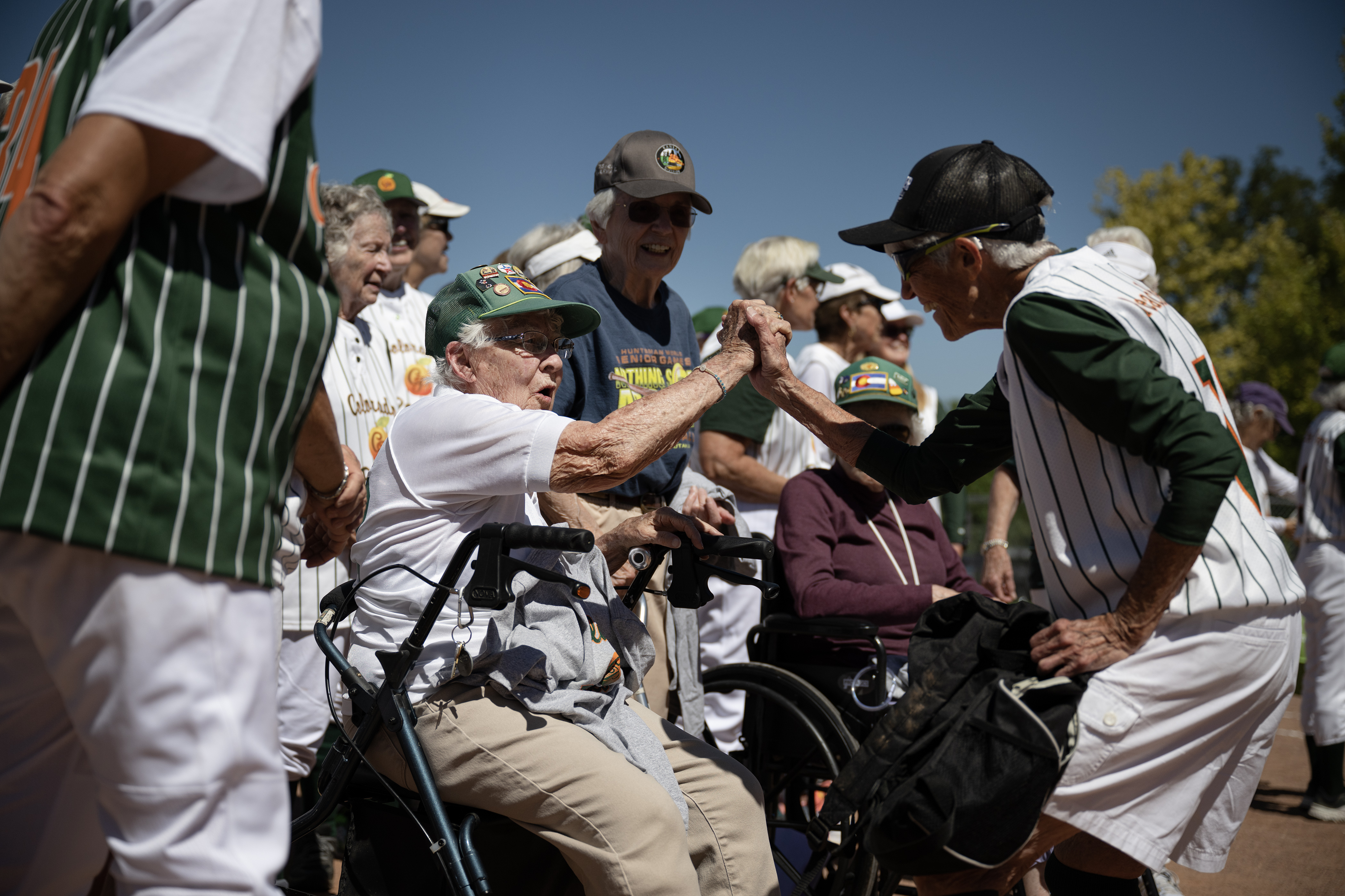 Colorado Peaches player Maggie McCloskey (13), playing with the Turnovers, grasps hands with Peaches founder Chloe Childers during a ceremony after the Second Annual Gail Klock Memorial Peach Bowl on Tuesday, Aug. 29, 2023, at Addenbrooke Park in Lakewood, Colo. 92-year-old Maggie McCloskey will be inducted into the Huntsman World Senior Games Hall of Fame this October. (Timothy Hurst/Denver Gazette) (TimHursttim.hurst@gazette.comhttps://secure.gravatar.com/avatar/aca82bd62b4ee425c598527cd6faa1b1?d=mm&r=g)