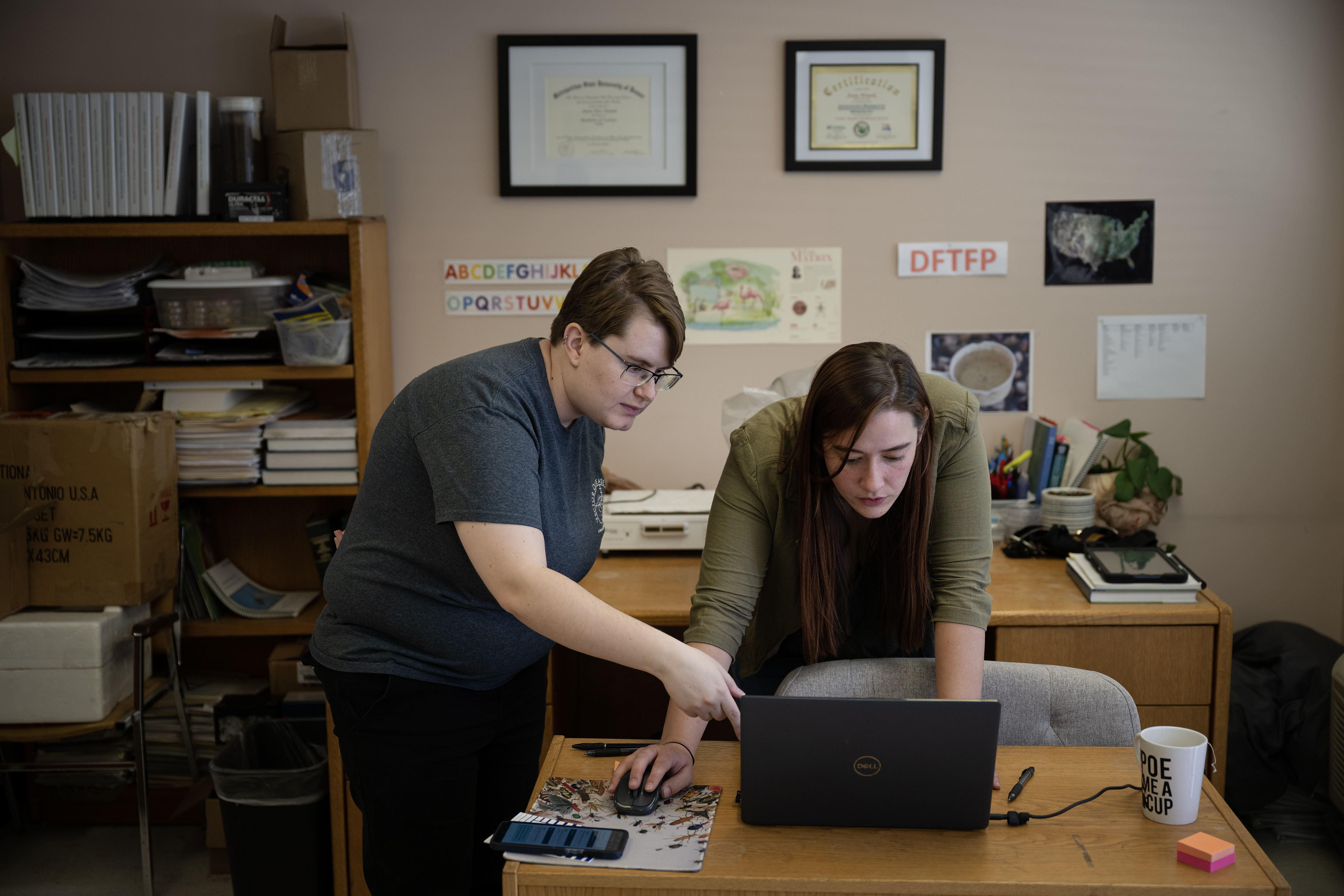 Surveillance manager Anna Wanek, right, and office administrator Liz Lynch look at a current CDC West Nile virus data at Vector Disease Control International on Thursday, Aug. 10, 2023, in Broomfield. (Timothy Hurst/Denver Gazette) (TimHursttim.hurst@gazette.comhttps://secure.gravatar.com/avatar/aca82bd62b4ee425c598527cd6faa1b1?d=mm&r=g)