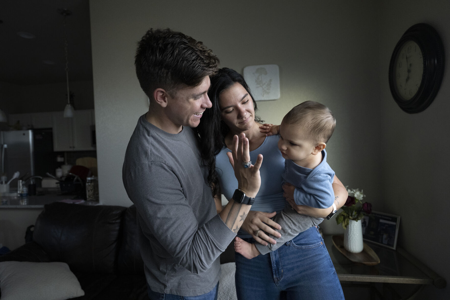 Zenen “Z” Cardenas and Sarah Swan play with their 9-month-old son, Mateo Cardenas, at their home last week. Cardenas and Swan were seniors at the Air Force Academy when Mateo was born. Cardenas graduated last spring, and Swan is finishing this school year. (Christian Murdock, The Gazette)