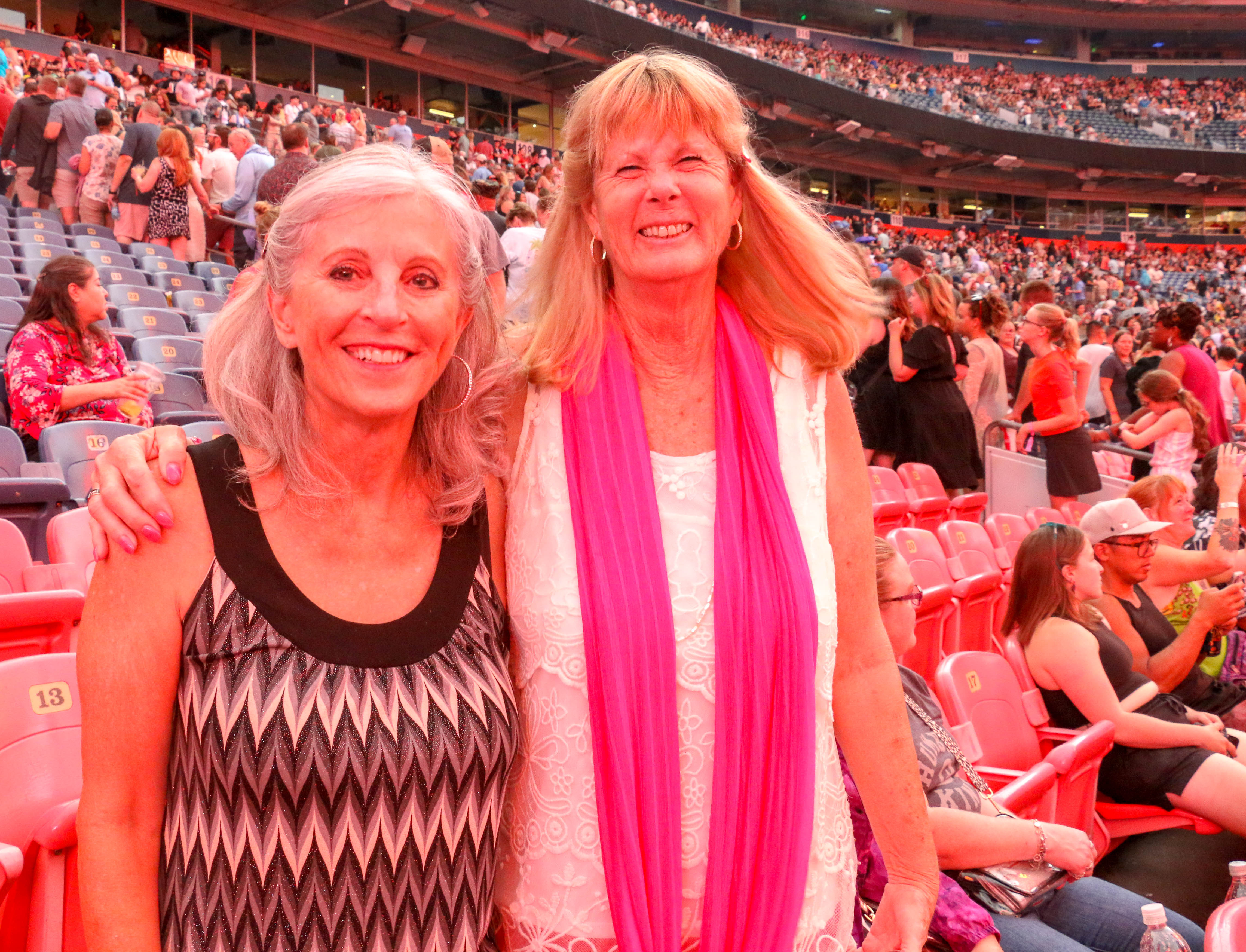 Karen Helton of Boise, Idaho, left, and Joyce Sorenson of Greeley came to Empower Field for the Ed Sheeran concert Aug. 19, 2023. (JOHN MOORE, Denver Gazette)