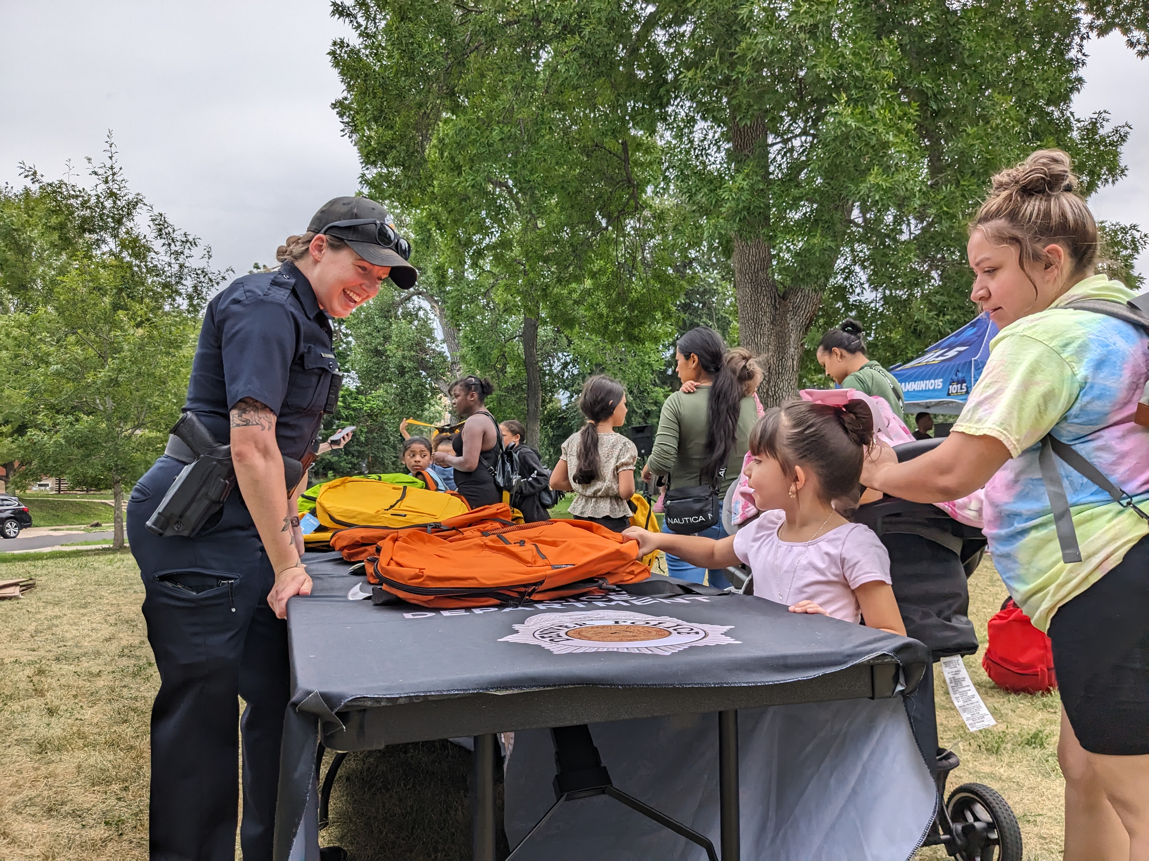 Officer Amanda Grodman gives away supplies and a smile. (SageKelleyJefferson County Reportersage.kelley@denvergazette.comhttps://denvergazette.com/content/tncms/avatars/e/5f/457/e5f45740-2717-11ee-85b2-ab80f2d36252.5b966c1d2ce4987987665d57c237eda4.png)