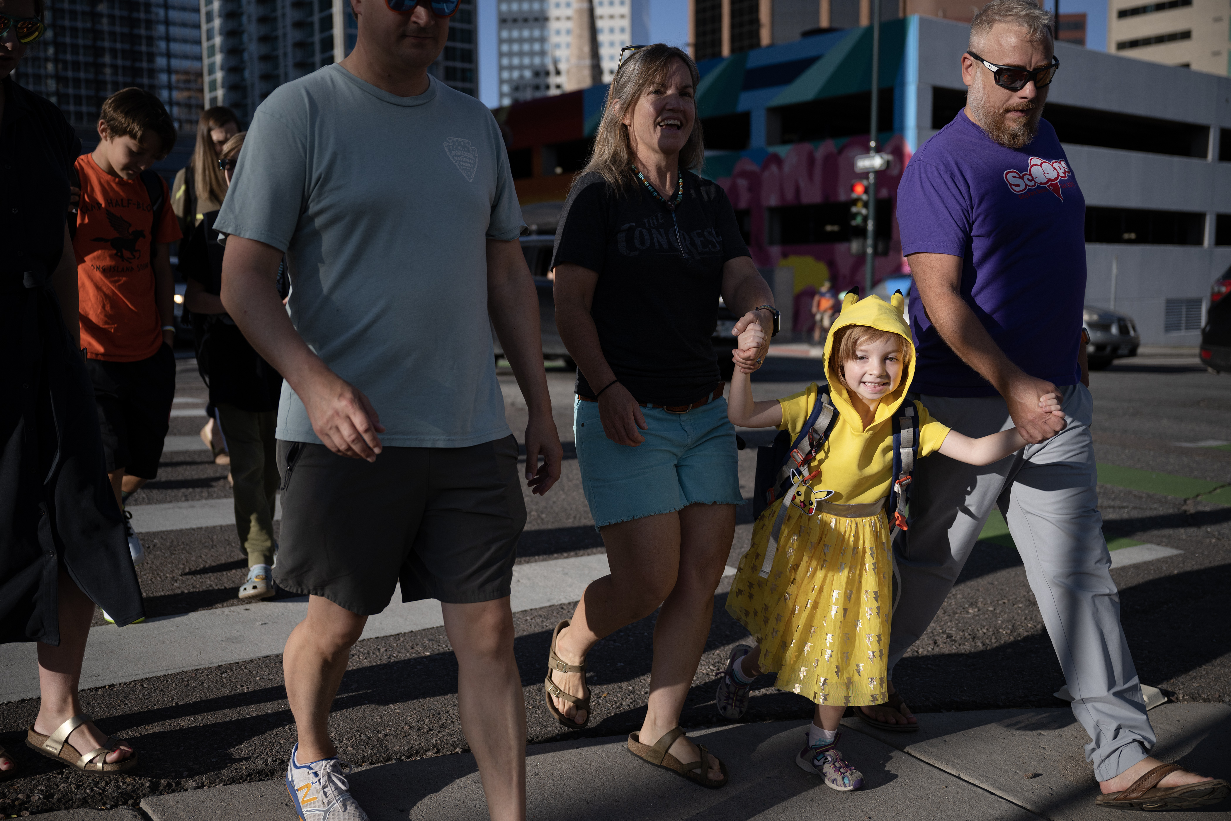 Phoenix Lawson holds her parents’ hands, Lauri Keener and David Lawson, as they cross the street to drop Phoenix off with her classmates during the first day of Denver Public School’s Fall semester on Monday, Aug. 21, 2023, at Downtown Denver Expeditionary School in Denver, Colo.(Timothy Hurst/Denver Gazette) (TimHursttim.hurst@gazette.comhttps://secure.gravatar.com/avatar/aca82bd62b4ee425c598527cd6faa1b1?d=mm&r=g)