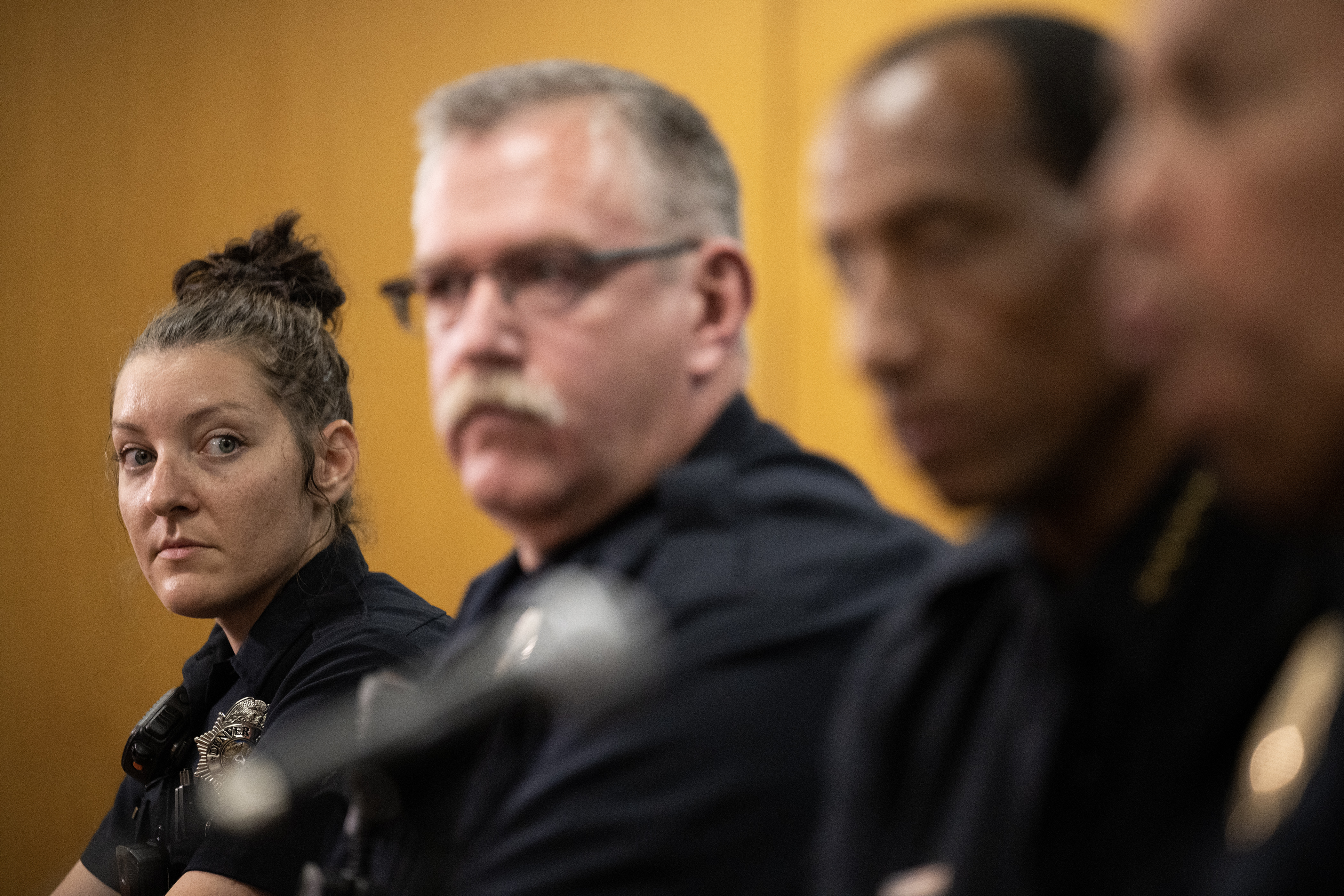 Denver Police Department school resource officer Stephanie Reyes looks on while and Tim Cueva, look on as division chief of patrol Aaron Sanchez answers a question during a roundtable interview with school resource officers on Friday, Aug. 18, 2023, at the Denver Police Department’s headquarters in Denver. (Timothy Hurst/Denver Gazette) (TimHursttim.hurst@gazette.comhttps://secure.gravatar.com/avatar/aca82bd62b4ee425c598527cd6faa1b1?d=mm&r=g)