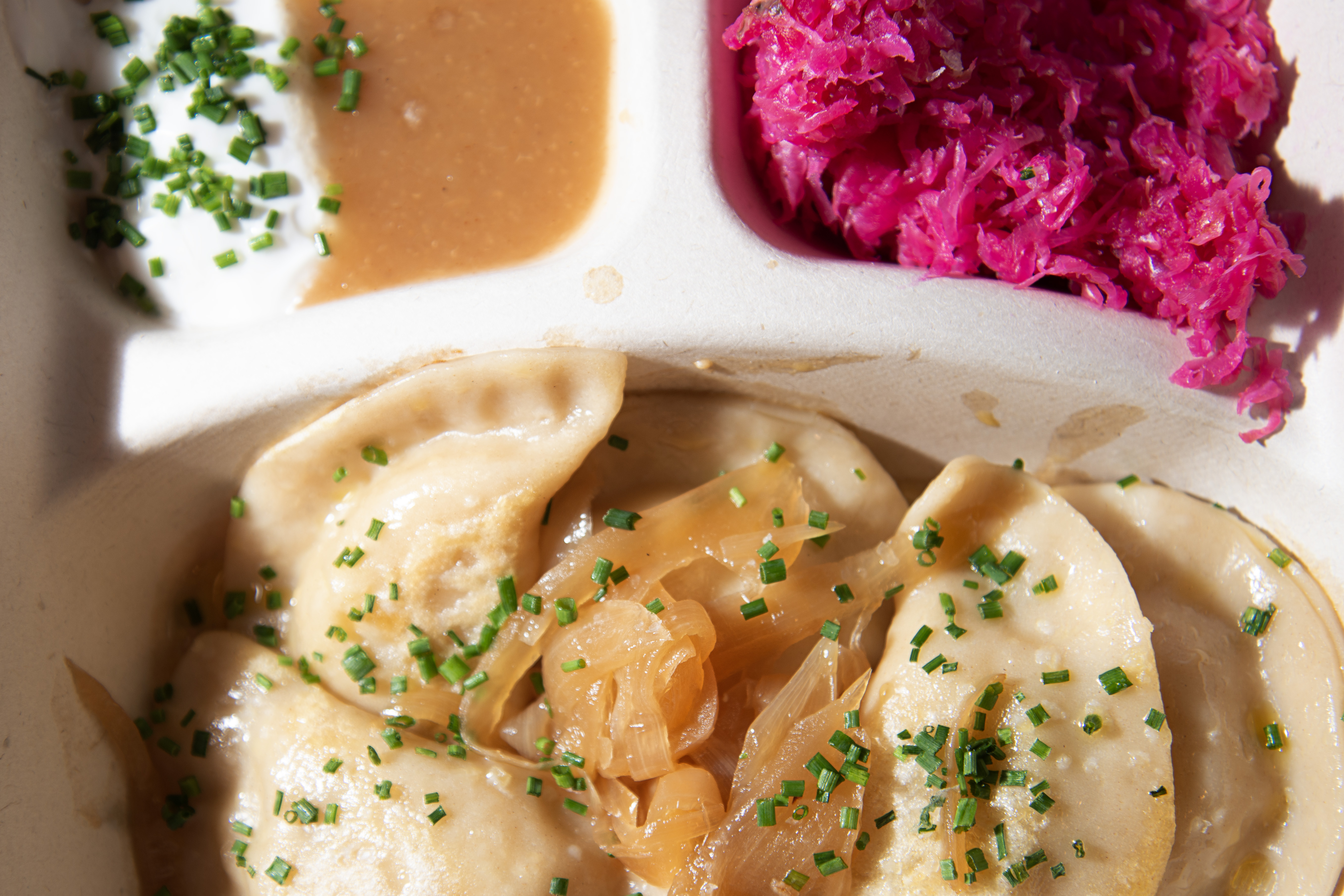 The pierogis at The Easy Vegan contain potato and are covered in caramelized onion and chives, served next to ruby kraut, coconut sour cream and apple sauce. (TomHellauerMultimedia Producertom.hellauer@denvergazette.comhttps://denvergazette.com/content/tncms/avatars/f/9e/622/f9e6228a-3b6b-11ed-bf10-fbb71fa8e421.f54b911252c540f1d61709edc4727a39.png)