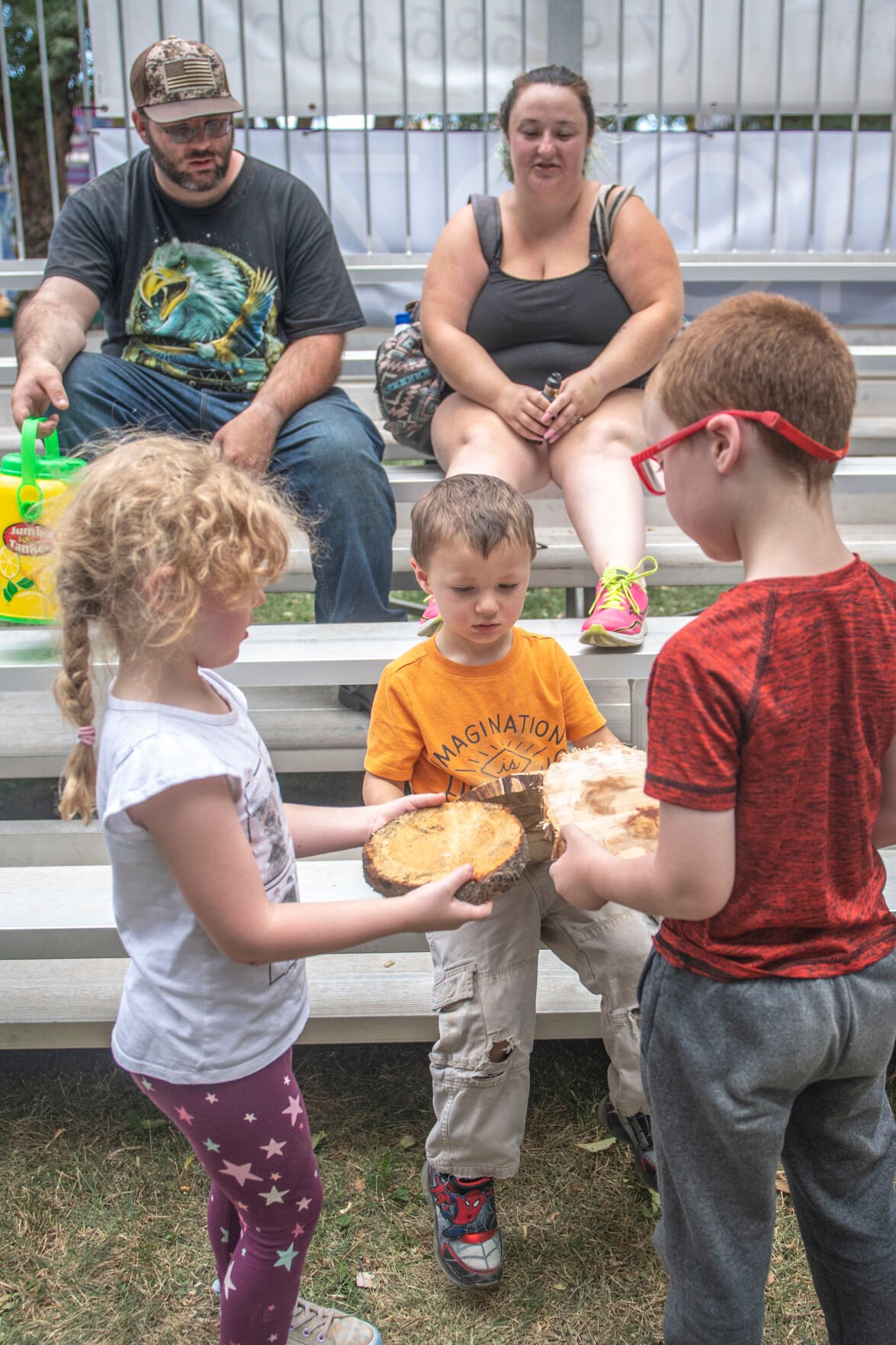 The crowd of the Paul Bunyan Lumberjack Show received ‘beaver chips’ from the show’s owner Lee LeCapitan during the first day of the Colorado State Fair in Pueblo, Colo. on Friday, August 25, 2023. (Gabi Broekema)