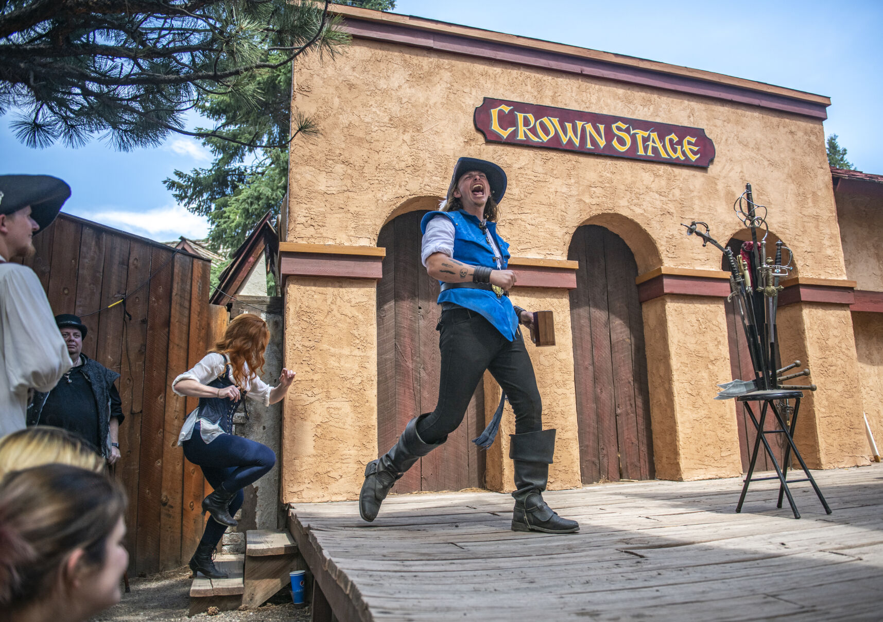 Sword swallower Cyrus Pynn takes the stage at the Colorado Renaissance Festival in Colorado Springs, Co., on Saturday, July 29, 2023. (Gabi Broekema)