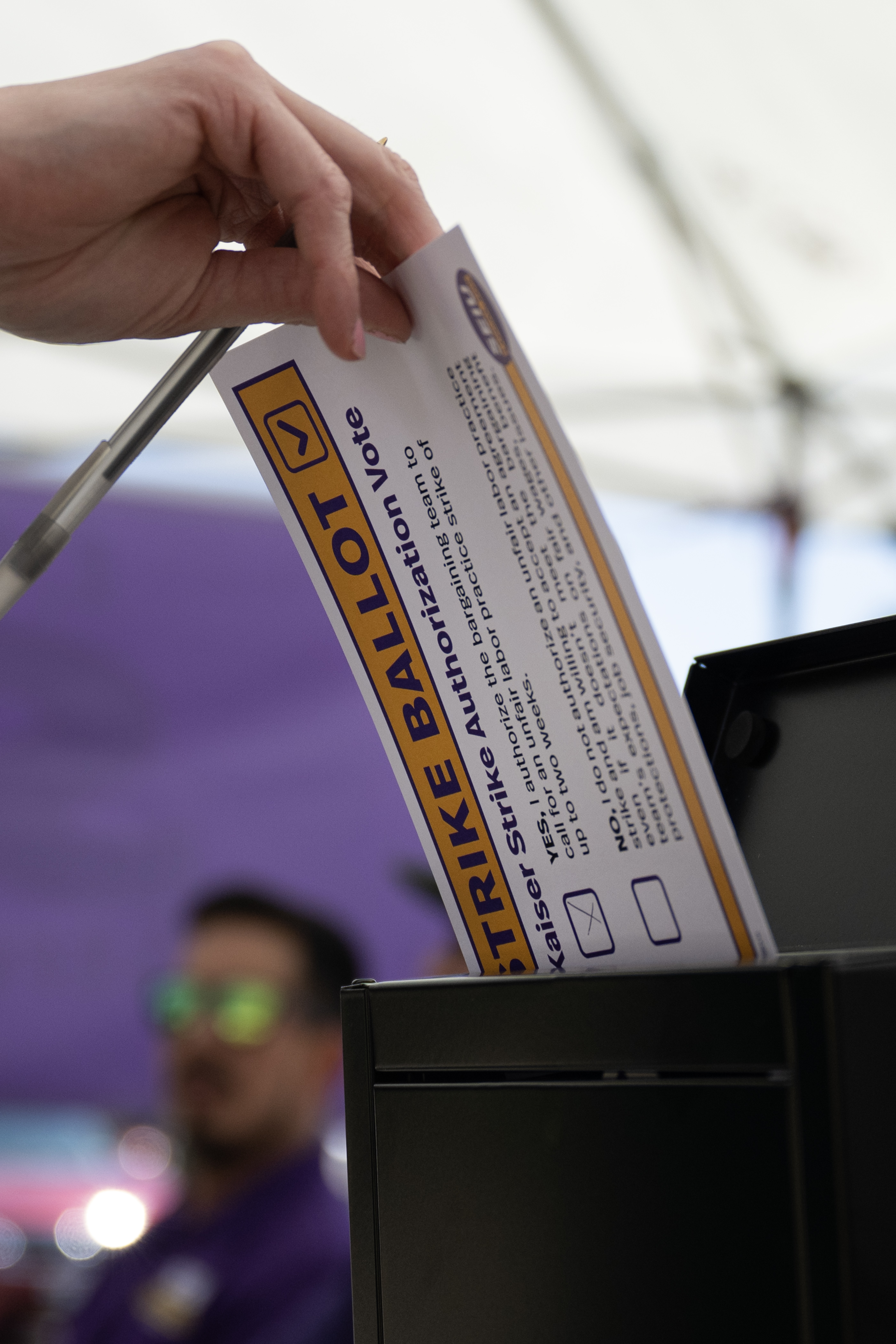 A Kaiser Permanente employee who requested to remain anonymous casts their vote to authorize a strike at a voting tent set up by Service Employees International Union Local 105 Denver, outside of the Kaiser Permanente Franklin Medical Offices on Thursday, Aug. 31, 2023, in Denver. (Timothy Hurst/Denver Gazette) (TimHursttim.hurst@gazette.comhttps://secure.gravatar.com/avatar/aca82bd62b4ee425c598527cd6faa1b1?d=mm&r=g)
