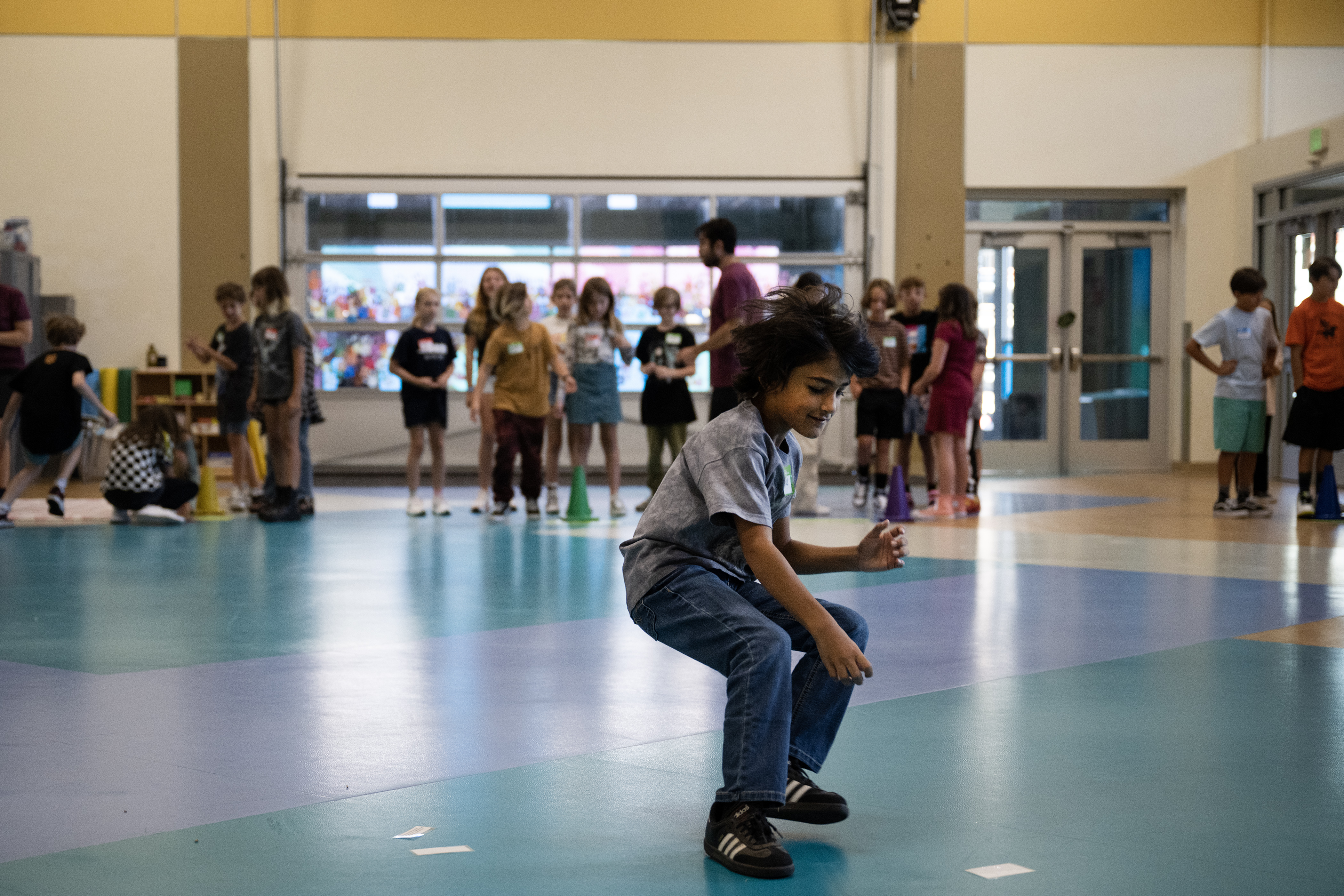 Fifth grader Marcus Johnson runs to the middle of the room to grab a sheet of paper that he’ll bring back to his group during a game they’re calling “Norm Match Dash” in Z Flatley’s movement class on the first day of Denver Public School’s Fall semester on Monday, Aug. 21, 2023, at Downtown Denver Expeditionary School in Denver, Colo.(Timothy Hurst/Denver Gazette) (TimHursttim.hurst@gazette.comhttps://secure.gravatar.com/avatar/aca82bd62b4ee425c598527cd6faa1b1?d=mm&r=g)